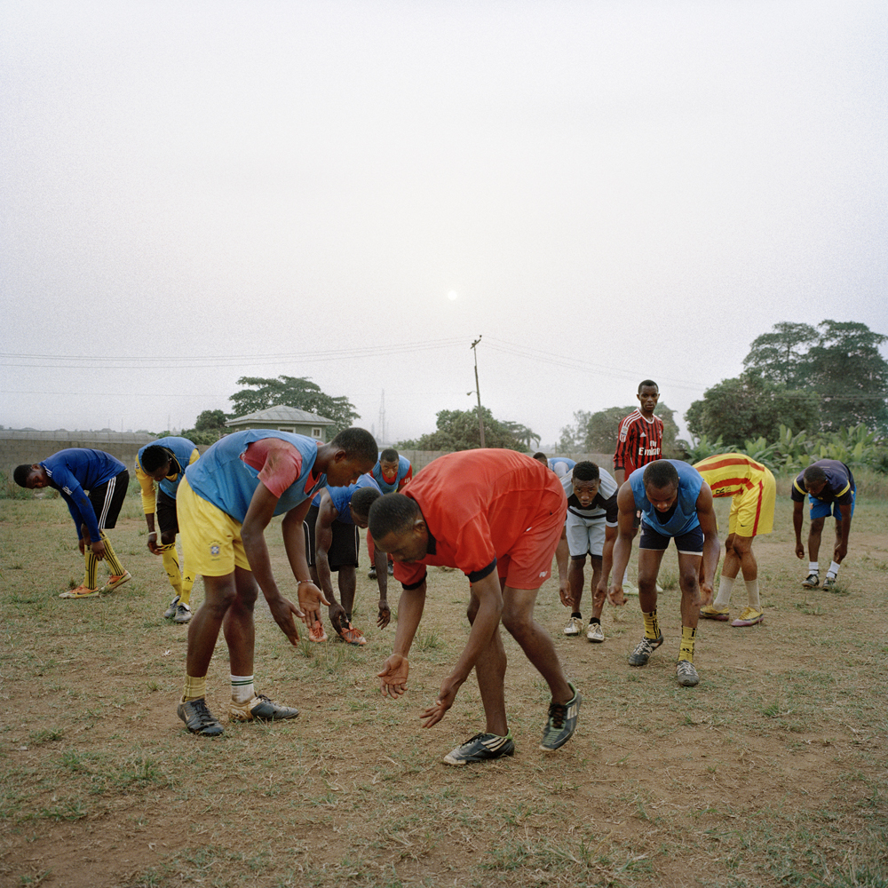 Adegeye, a former professional Nigerian footballer, leads members of the Freedom Foundation Apostolic Revival International Ministries (FARIM) soccer team through football exercises at the Government Technical College in February 2014 in Ikorodu, Nigeria.