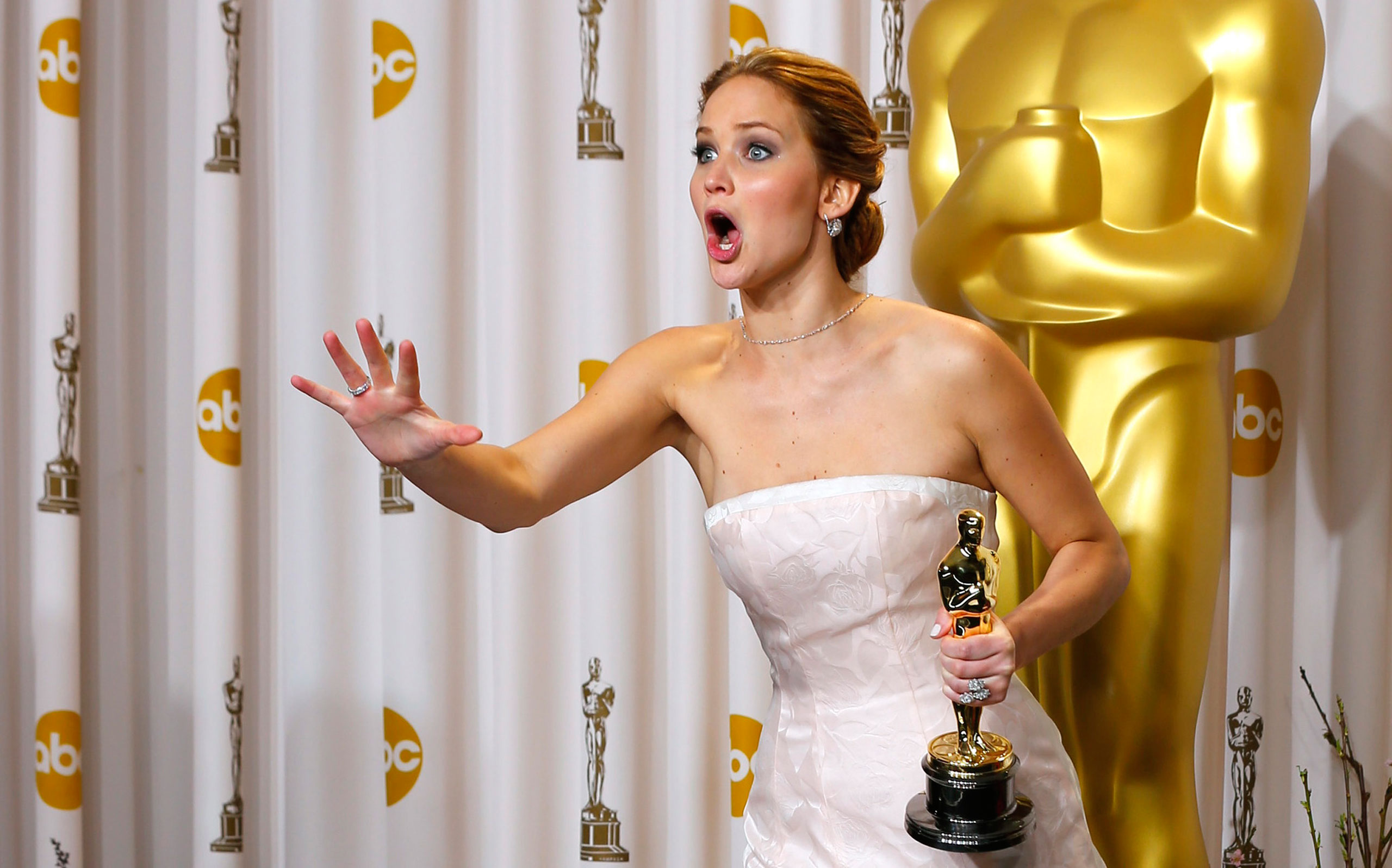 Jennifer Lawrence, best actress winner for her role in  Silver Linings Playbook,  reacts after photographers take a picture of her backstage at the 85th Academy Awards in Hollywood, California February 24, 2013.