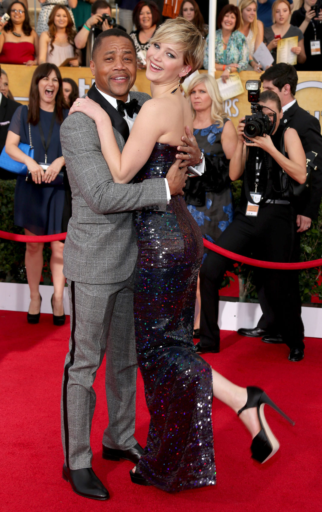 Cuba Gooding Jr. and Jennifer Lawrence arrive at the 20th Annual Screen Actors Guild Awards on January 18, 2014 in Los Angeles, California