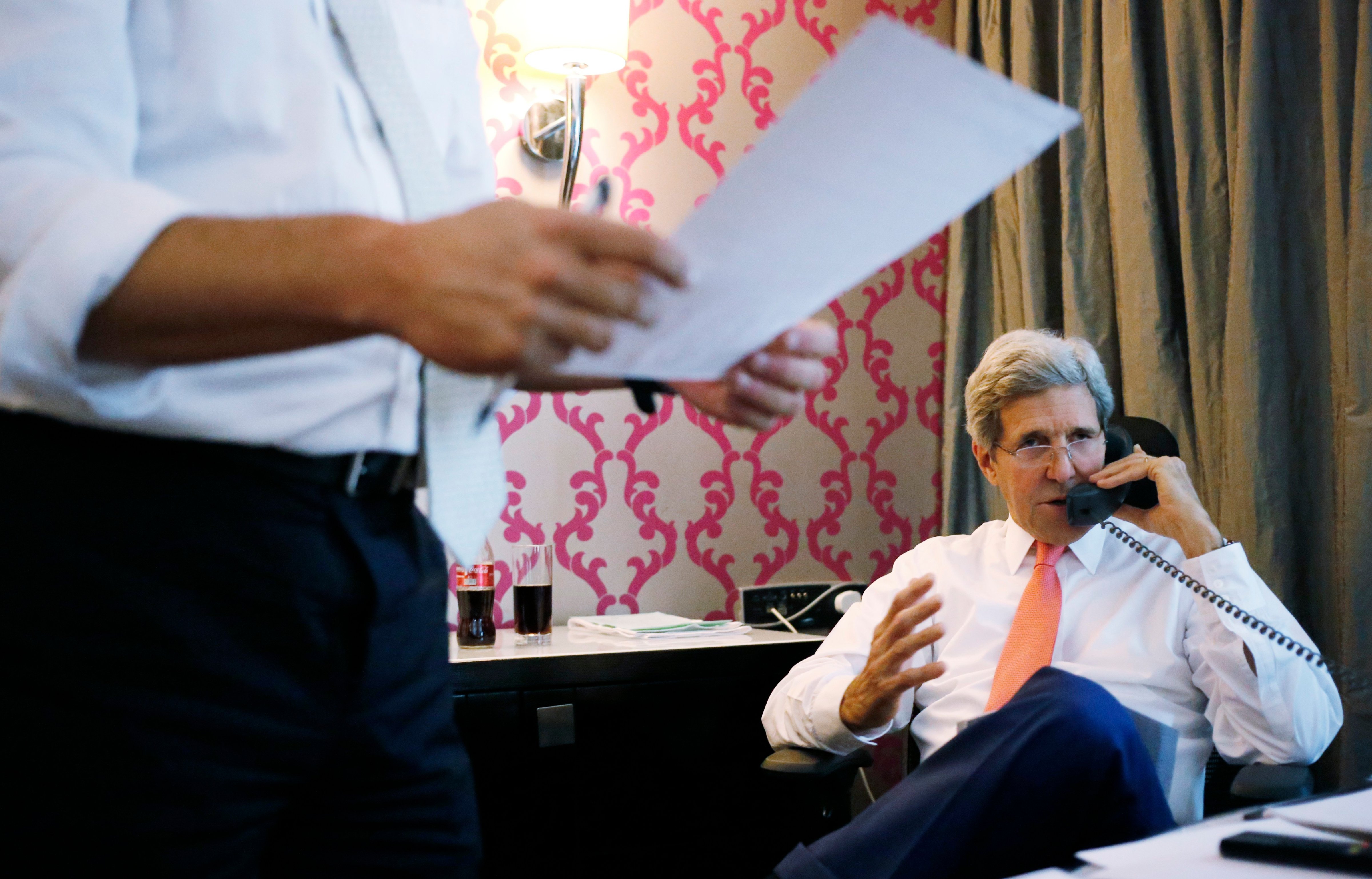 U.S. Secretary of State John Kerry talks to Israeli Prime Minister Benjamin Netanyahu about terms of a cease-fire in fighting in Gaza between Israel and Hamas on July 25, 2014.