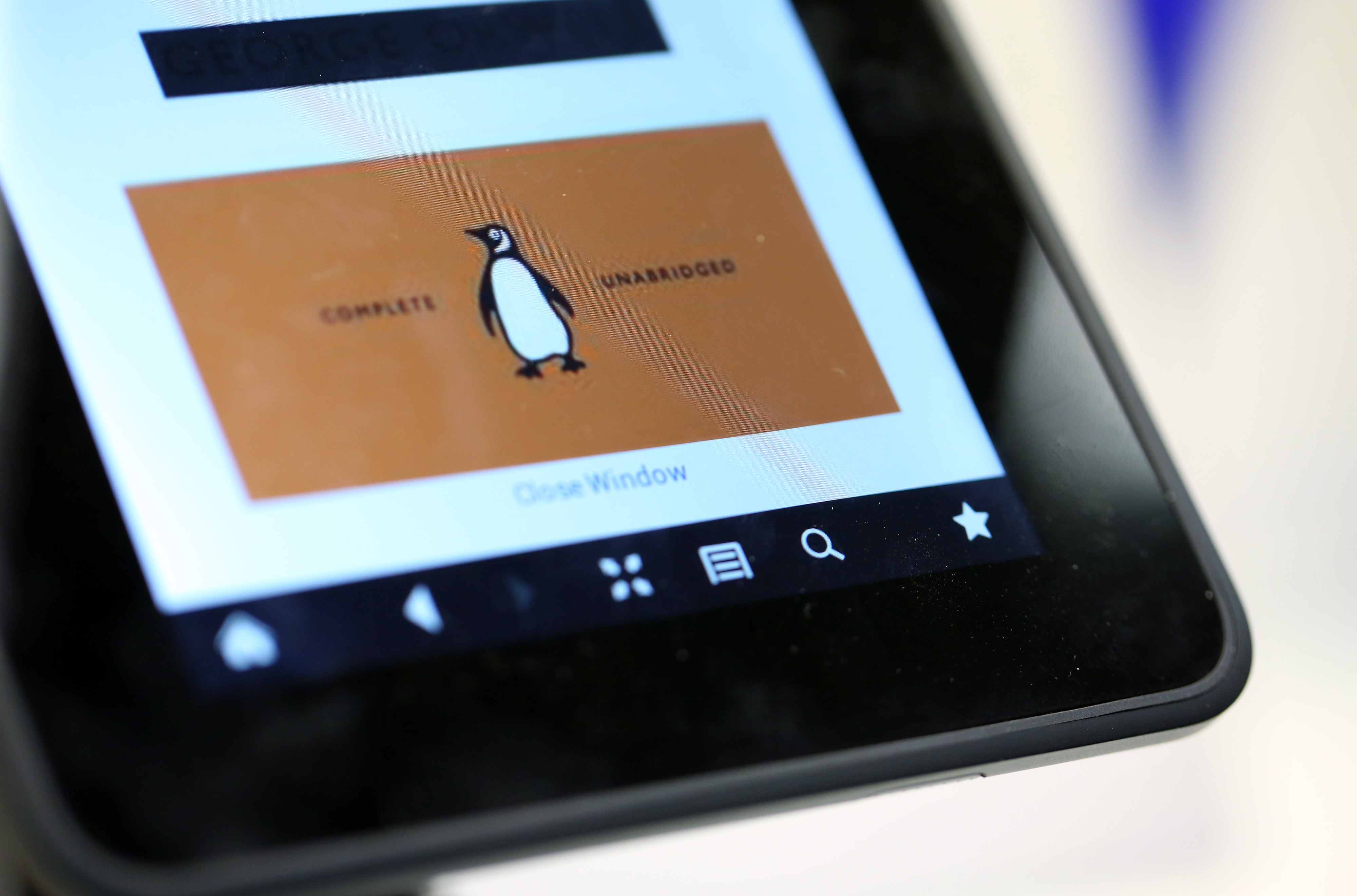 The logo of the Penguin publishing house, part of Pearson Plc, is seen on a Kindle Fire HD e-reader at a bookstore in London, U.K., on Friday, April 5, 2013. (Bloomberg/Getty Images)