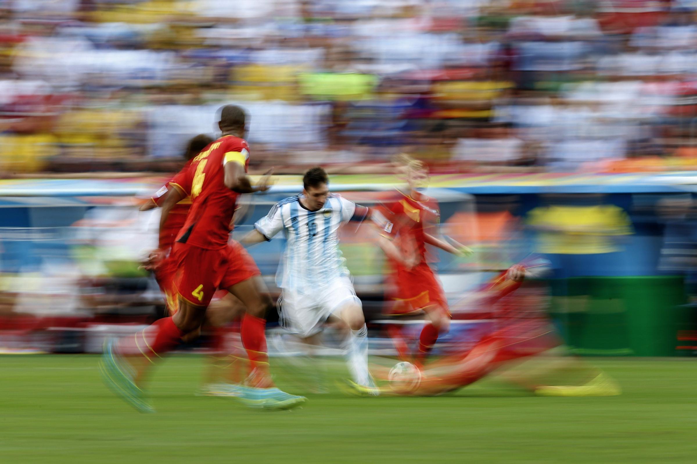 Argentina's Lionel Messi vies for the ball during a quarter-final football match between Argentina and Belgium at the Mane Garrincha National Stadium in Brasilia during the 2014 FIFA World Cup on July 5, 2014.