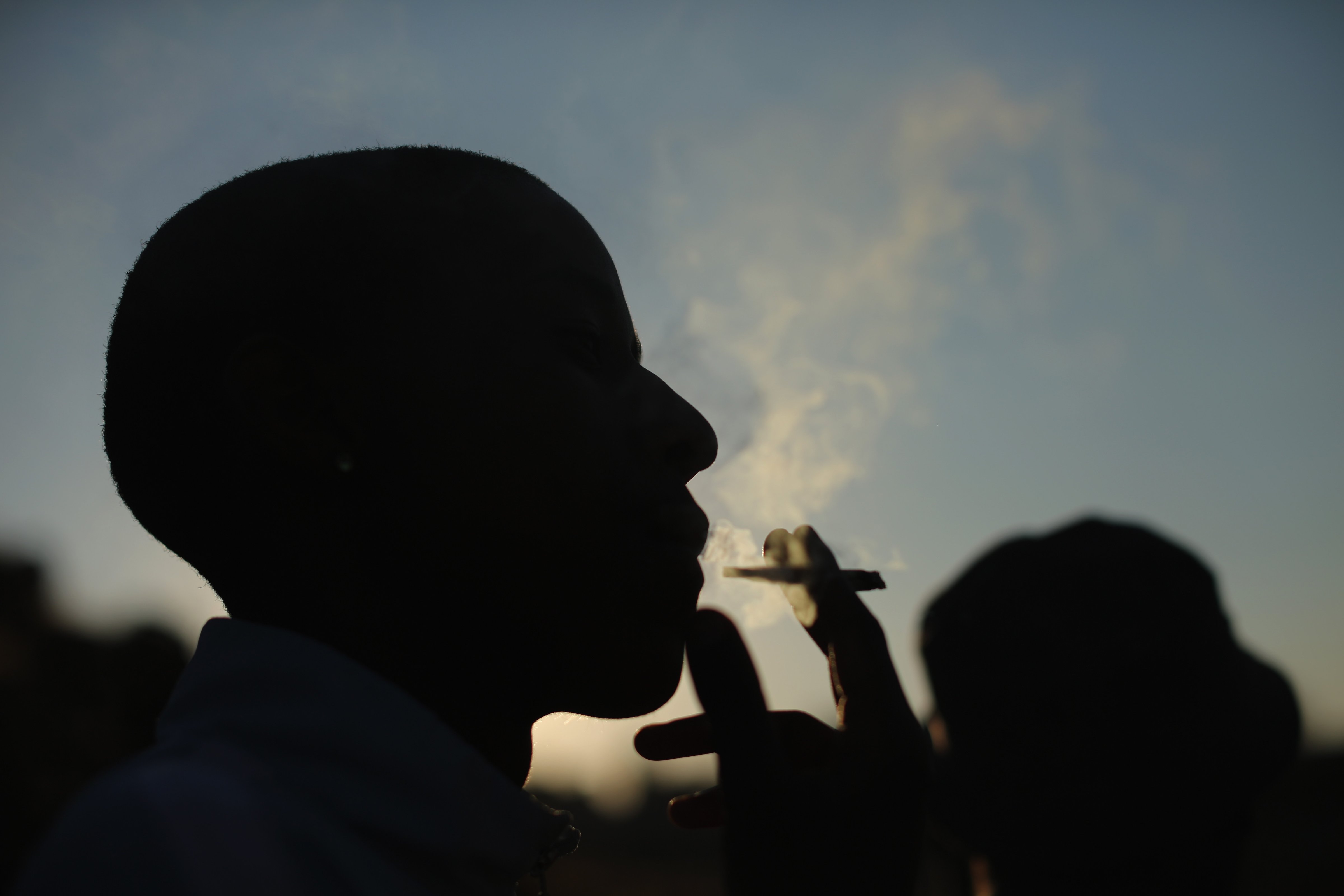 A youth smokes marijuana in Soweto township, near Johannesburg, on July 2, 2013 (Christopher Furlong—Getty Images)