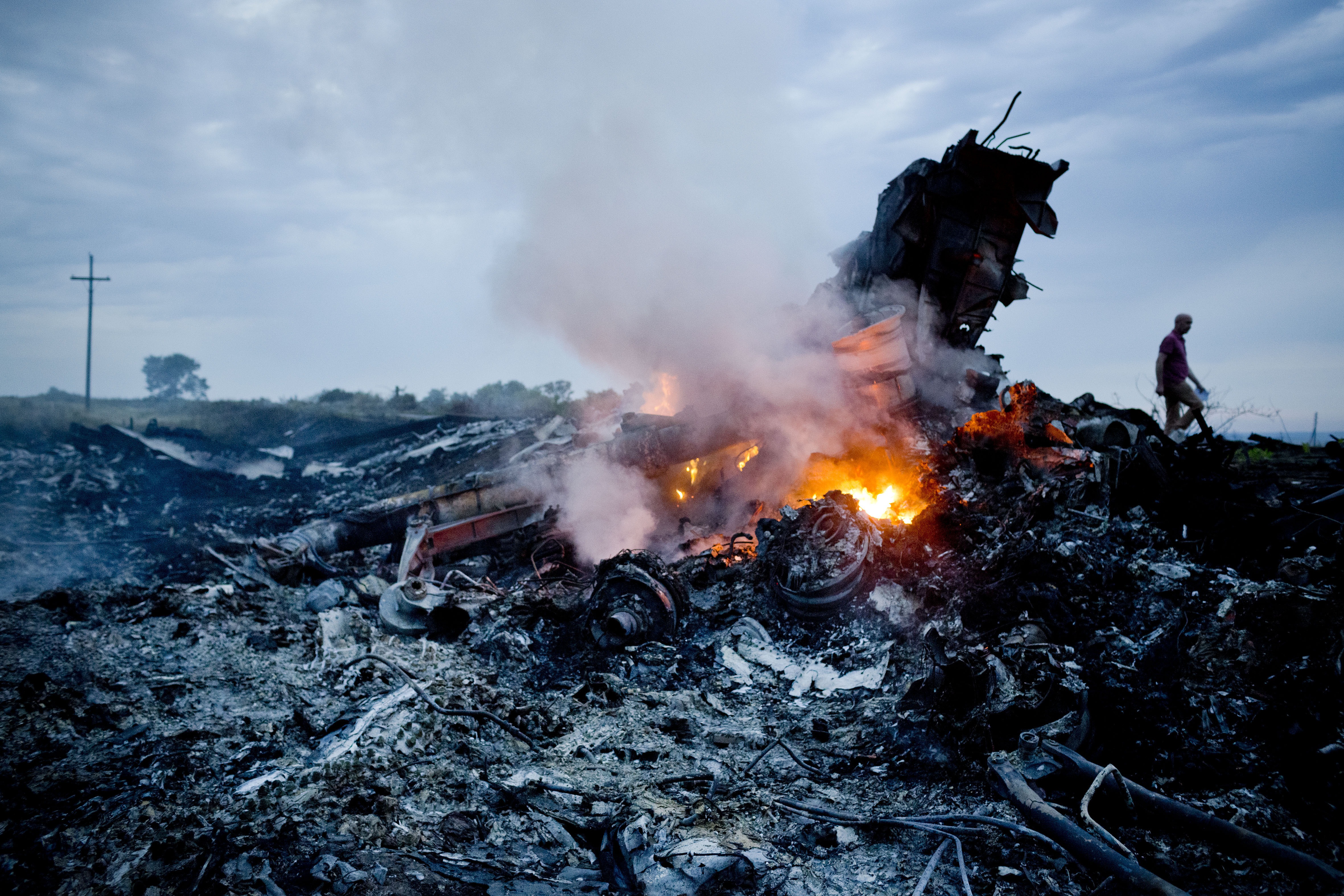 Debris from Malaysia Airlines Flight 17 is shown smouldering in a field  July 17, 2014 in Grabovo, Ukraine near the Russian border. (Pierre Crom—Getty Images)