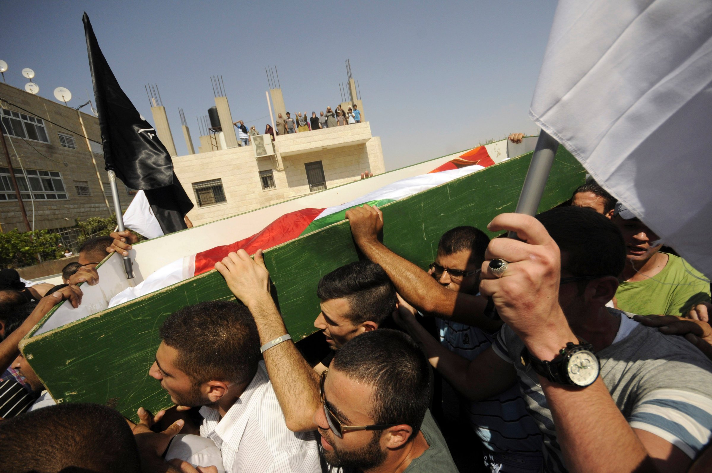 Palestinians carry the body of 16-year-old Mohammed Abu Khdeir in Jerusalem on Friday, July 4, 2014.
