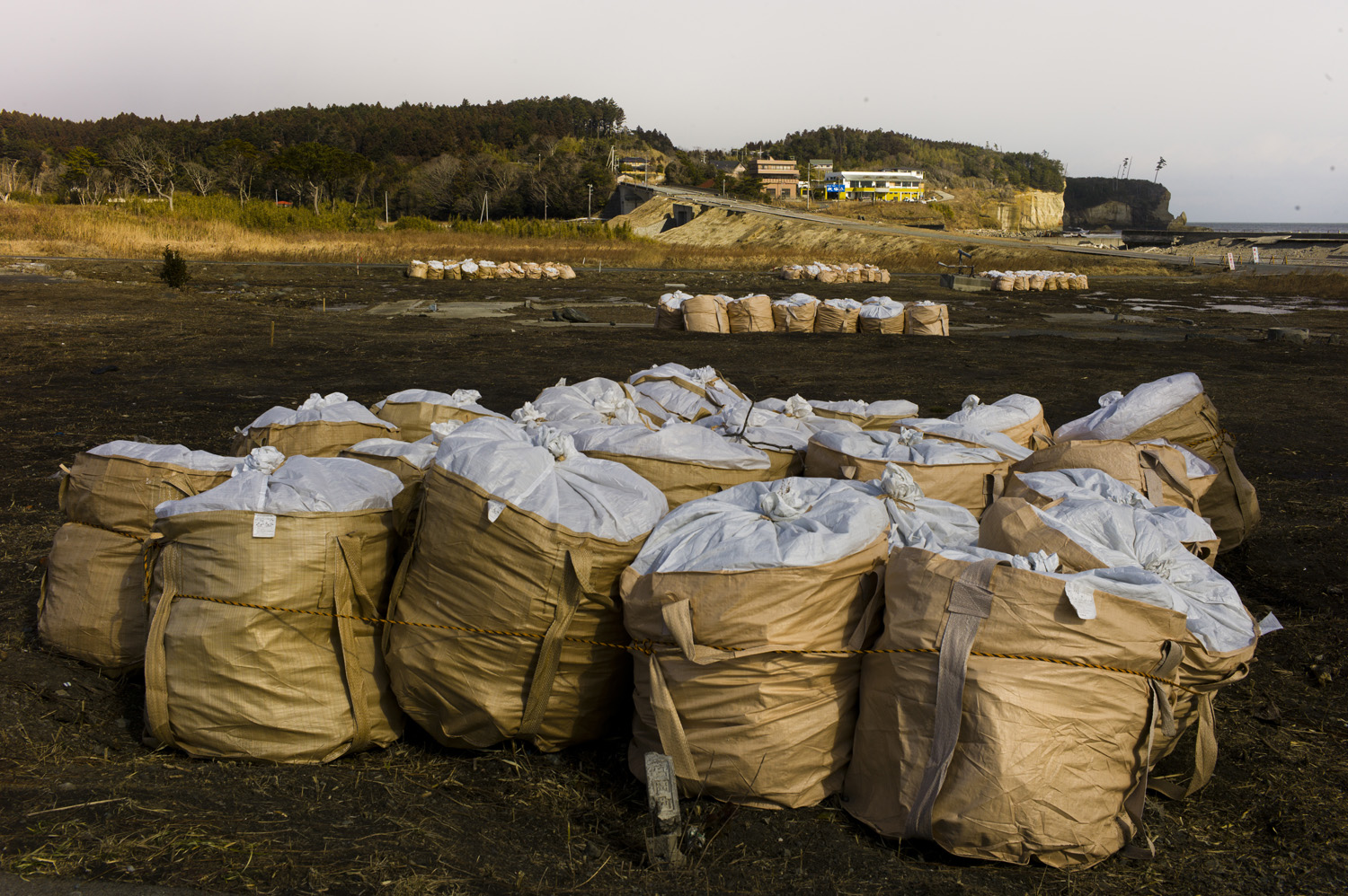 Japan, Tomioka, 2014. Bags containing radioactive material inside the 20-kilometer exclusion zone.