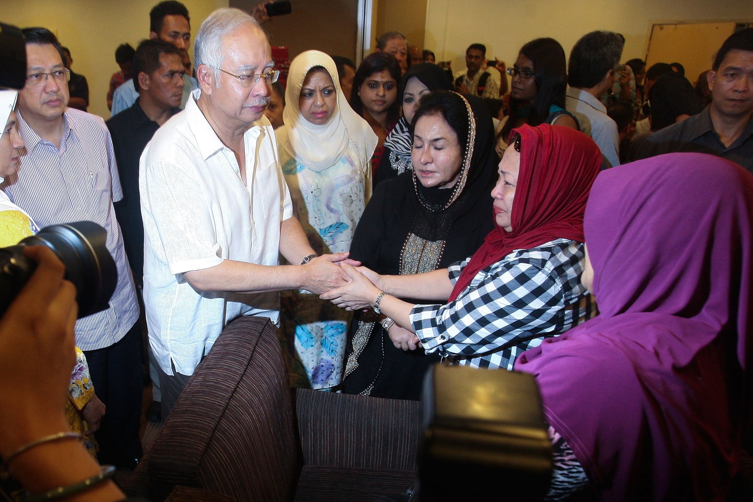 Malaysian Prime Minister Najib Razak and his wife Rosmah Mansor meet family members of the MH17 victim on July 19, 2014 in Kuala Lumpur, Malaysia.