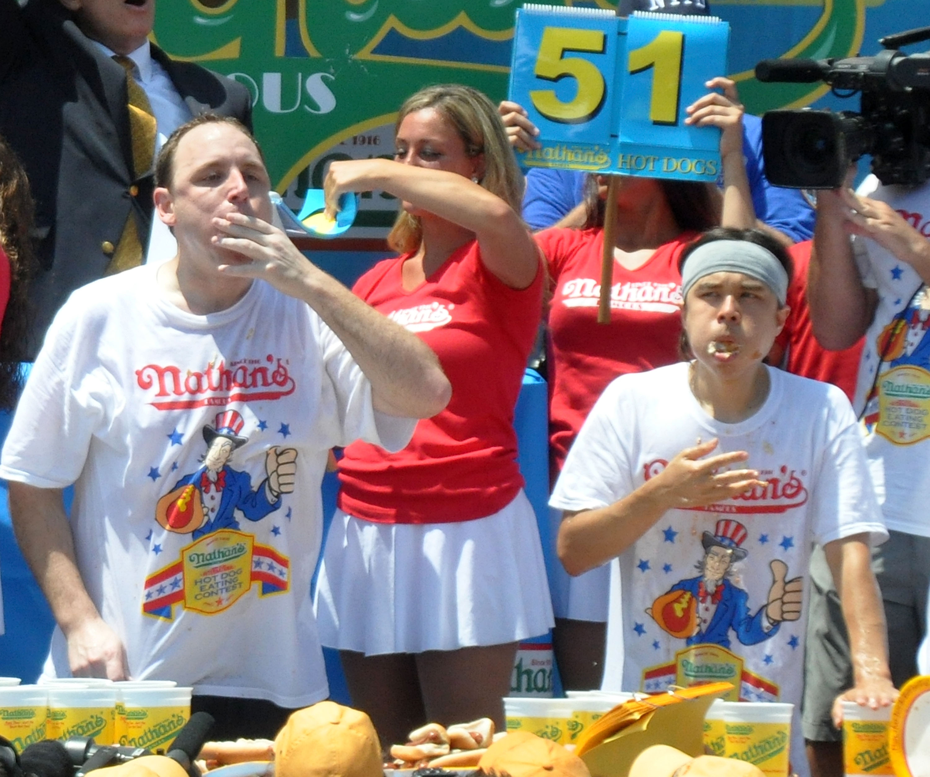 Joey Chestnut and Matt Stonie compete in the 2013 Nathan's Famous Hot Dog Eating Contest at Coney Island on July 4, 2013 in New York City. (Bobby Bank—WireImage)