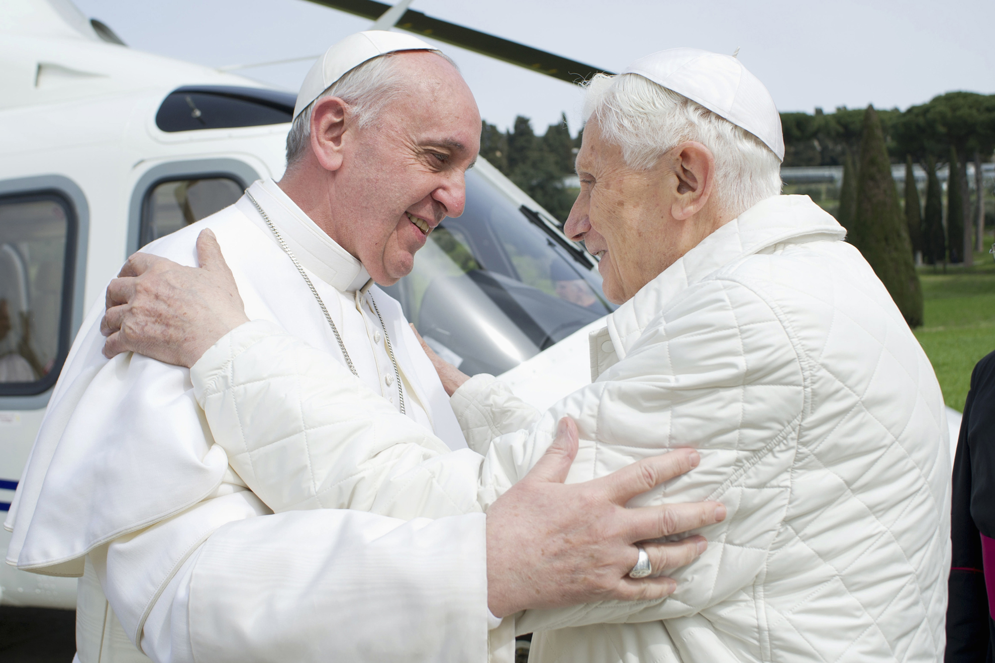 Pope Francis embraces Pope Emeritus Benedict XVI at the Castel Gandolfo summer residence in 2013.