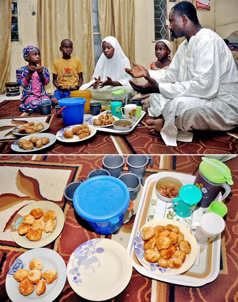 A Muslim family says prayers before breaking their fast in Kano, Nigeria on July 5, 2014.