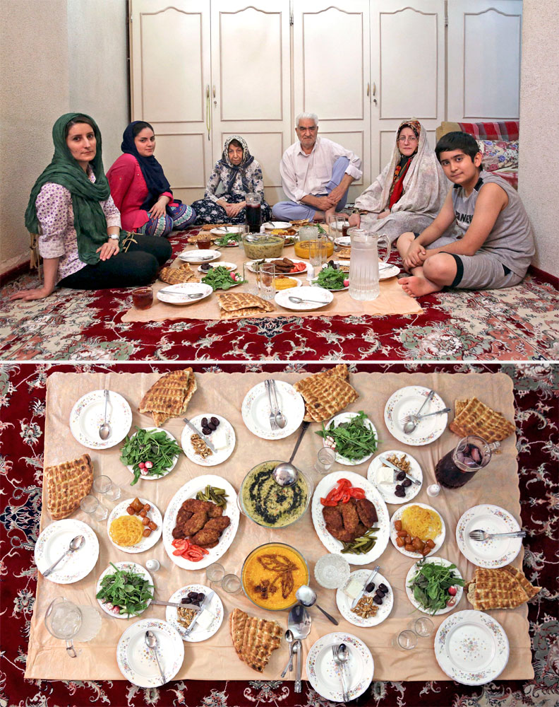 A Muslim family waits to break their fast in Tehran on July 3, 2014.