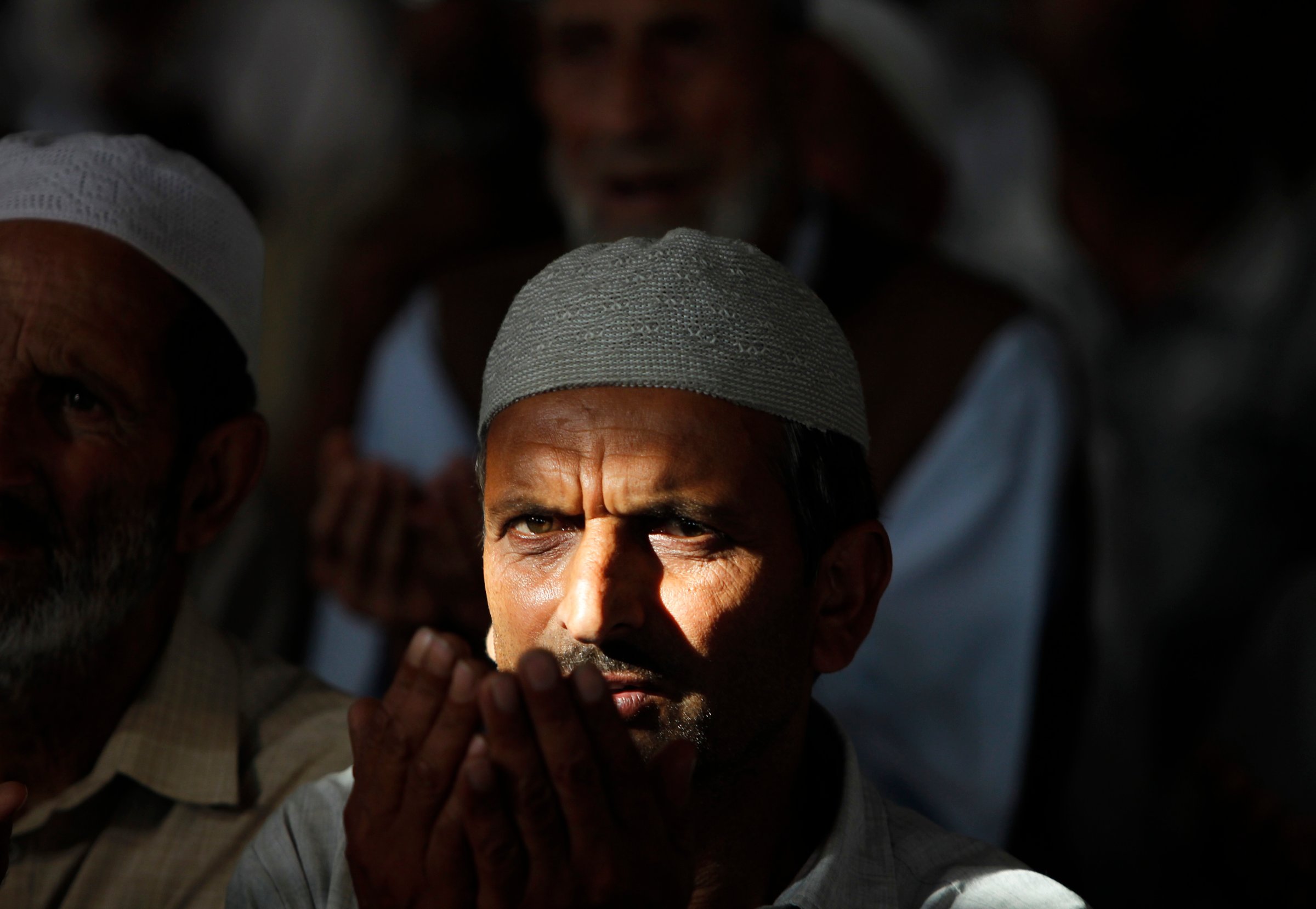 A Kashmiri Muslim man prays inside the shrine of a Sufi saint during the holy month of Ramadan in Srinagar