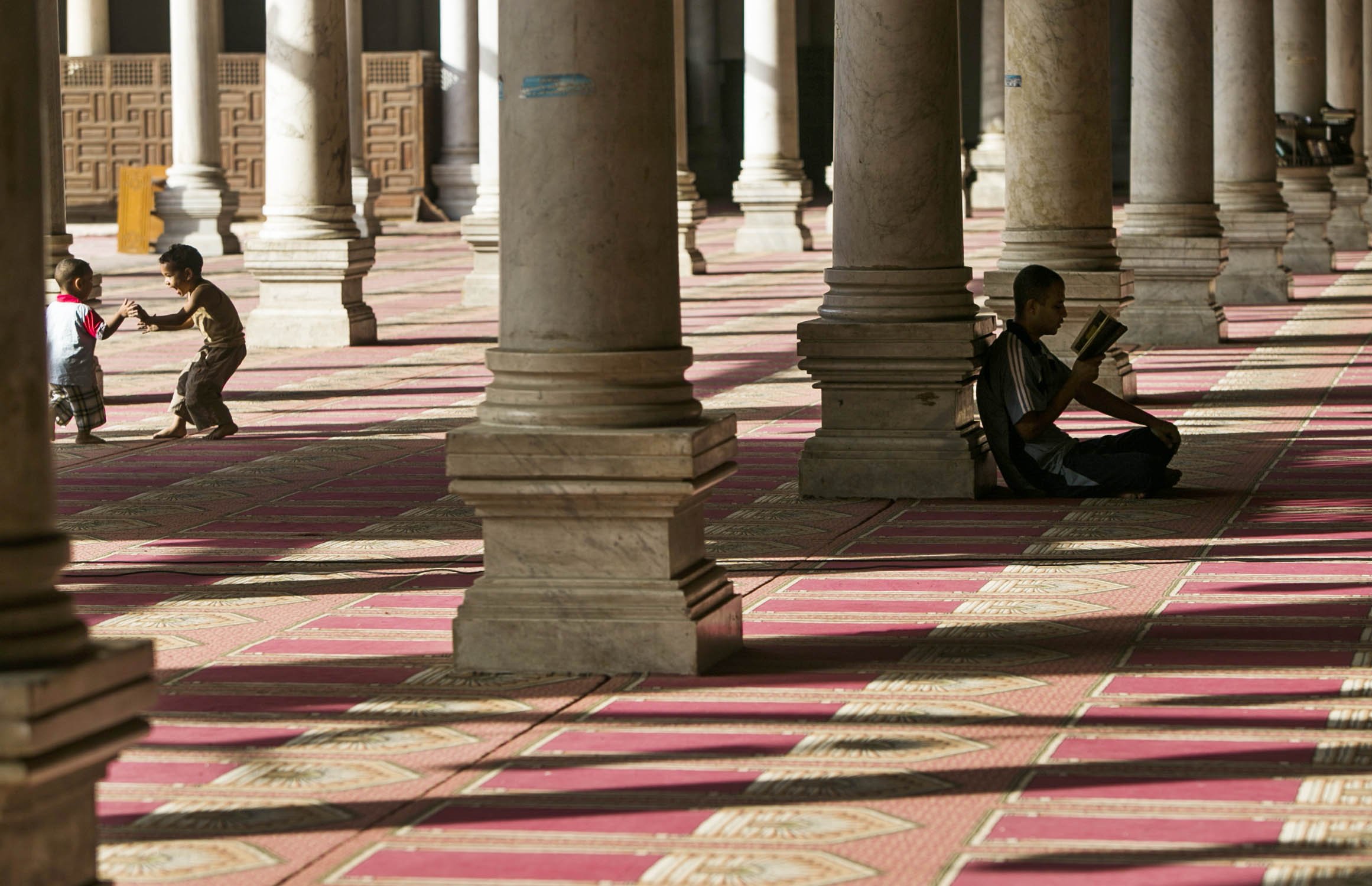 Egyptian children have fun inside a mosque during their fasting hours in a Ramadan afternoon in Cairo June 23, 2014. (Cui Xinyu—Xinhua Press/Corbis)
