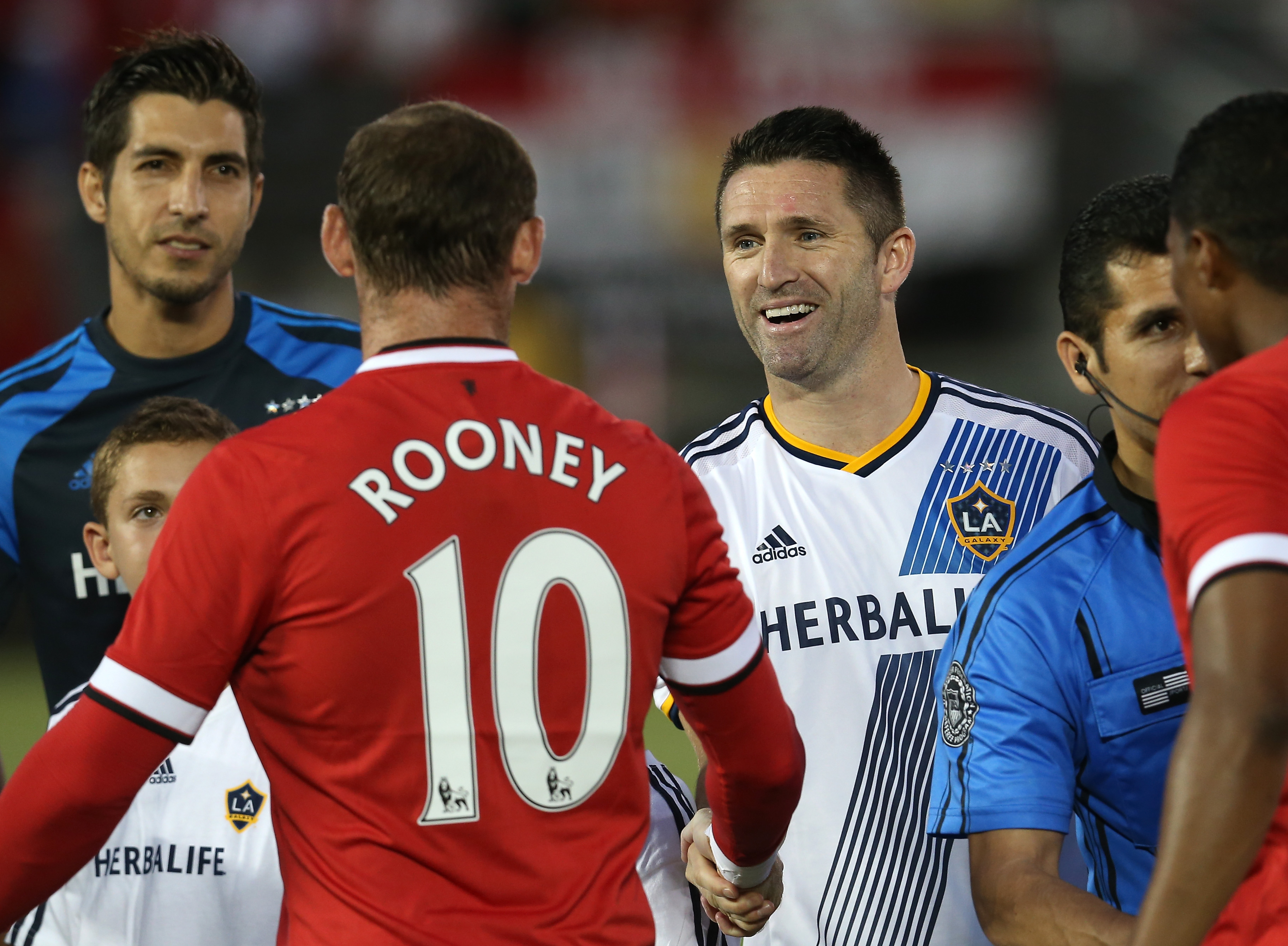 Robbie Keane #7 of the Los Angeles Galaxy greets Wayne Rooney #10 of Manchester United drurning prematch ceremonies at the Rose Bowl on July 23, 2014 in Pasadena, California. (Stephen Dunn—Getty Images)