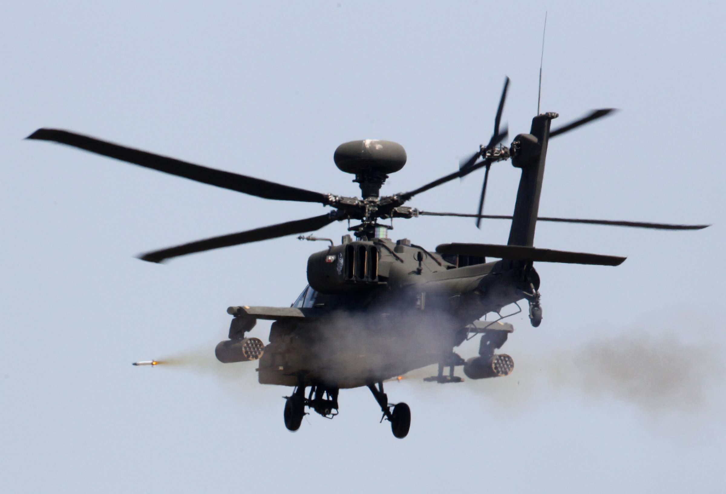 A U.S. AH-64 Apache helicopter fires a missile during a live fire gunnery exercise with the South Korean army at the U.S. army's Rodriguez range in Pocheon