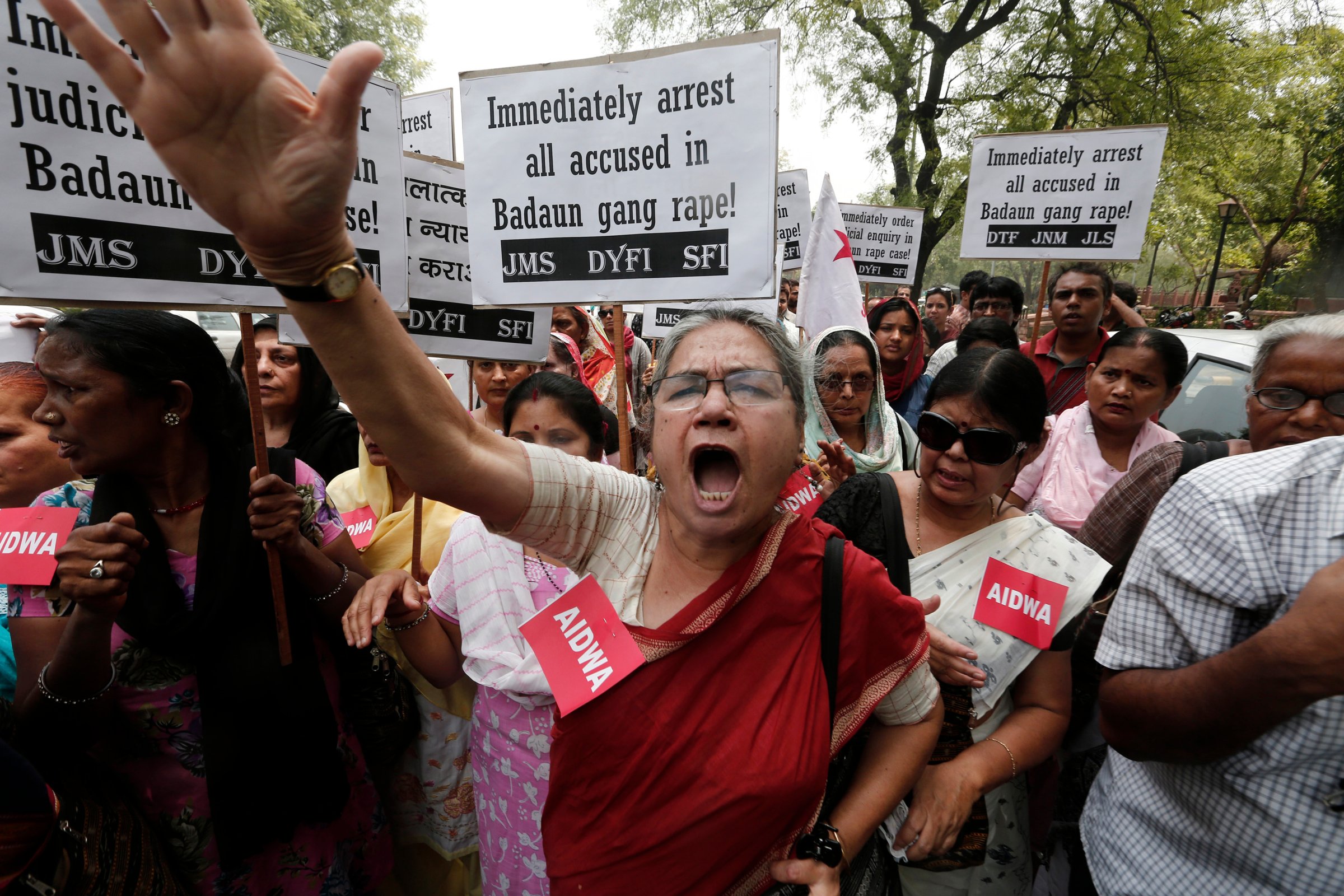 Demonstrators from AIDWA hold placards and shout slogans during protest against recent killings of two teenage girls, in New Delhi
