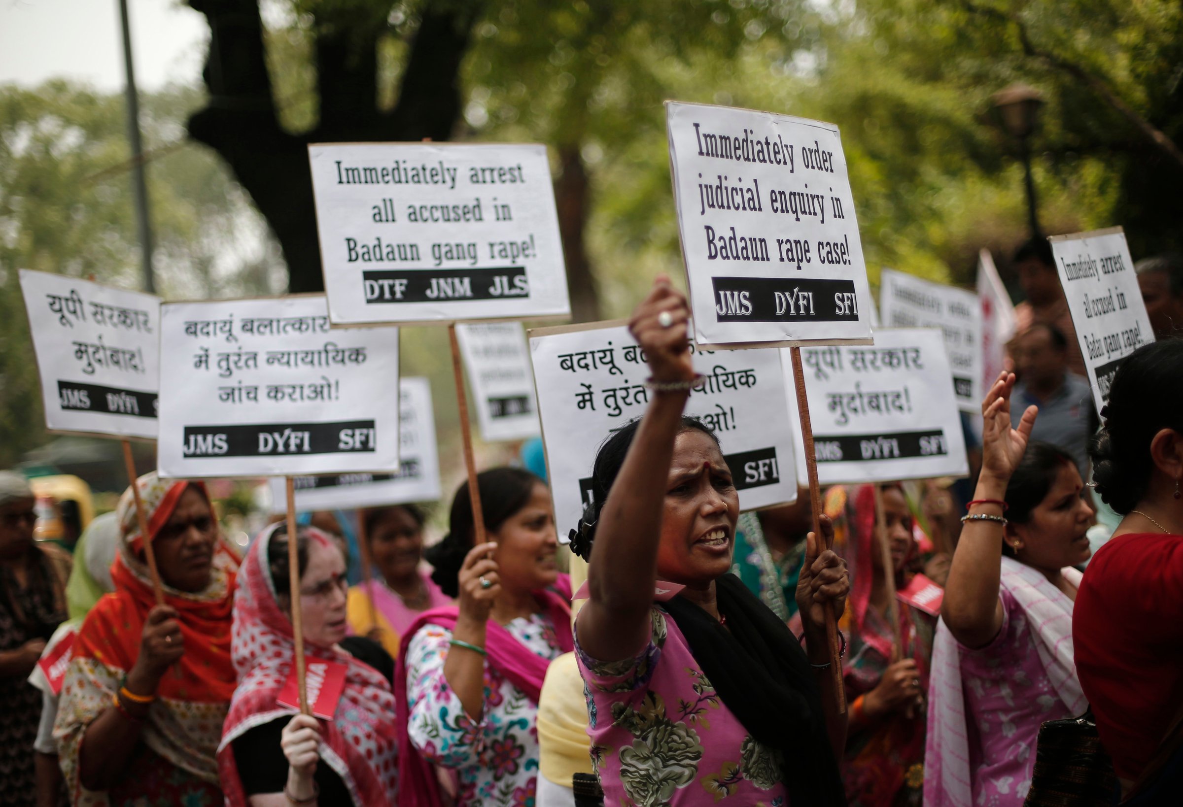 Demonstrators from AIDWA hold placards and shout slogans during protest against recent killings of two teenage girls, in New Delhi