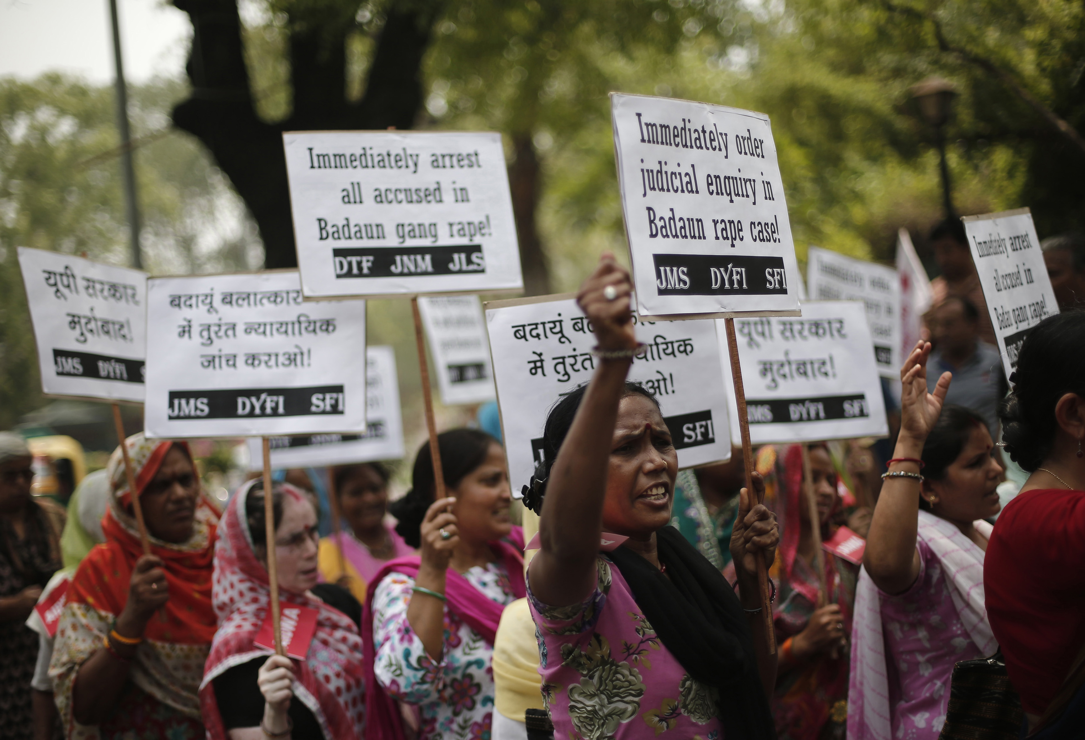 Demonstrators from the All India Democratic Women's Association hold placards and shout slogans during a protest against the rape and murder of two teenage girls, in New Delhi on May 31, 2014 (Adnan Abidi—Reuters)