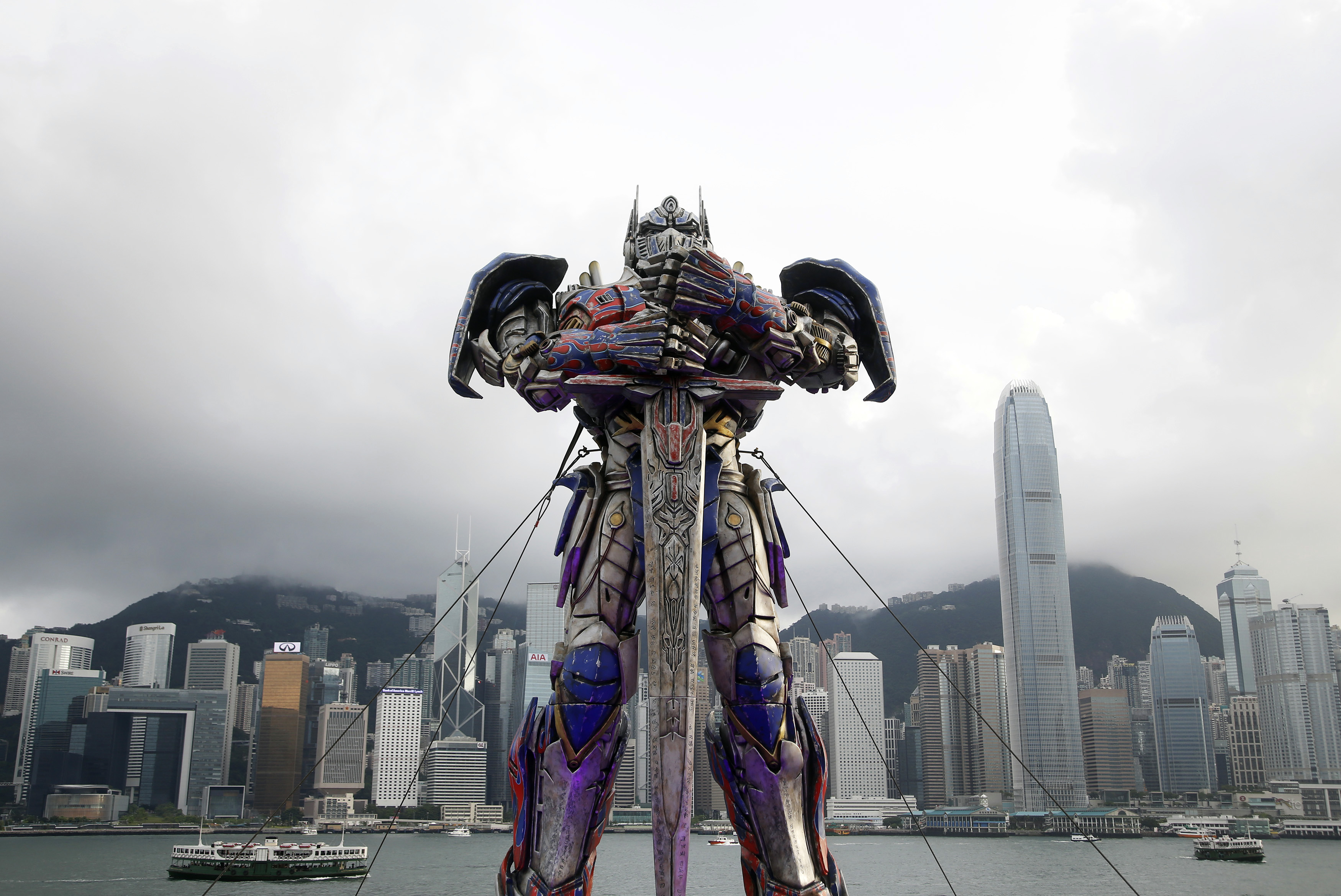 A 21-foot tall model of the Transformers character Optimus Prime is displayed on the red carpet before the world premiere of the film "Transformers: Age of Extinction" in Hong Kong