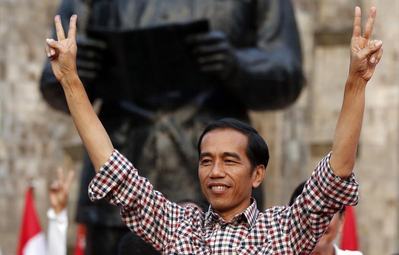 Indonesian presidential candidate Joko "Jokowi" Widodo gestures during a rally in Proklamasi Monument Park in Jakarta