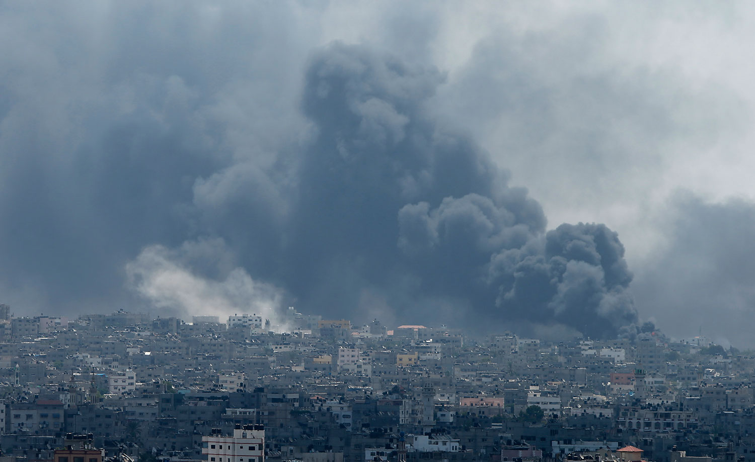 Smoke rises during what witnesses said were heavy Israeli shelling at the Shejaia neighbourhood in Gaza City