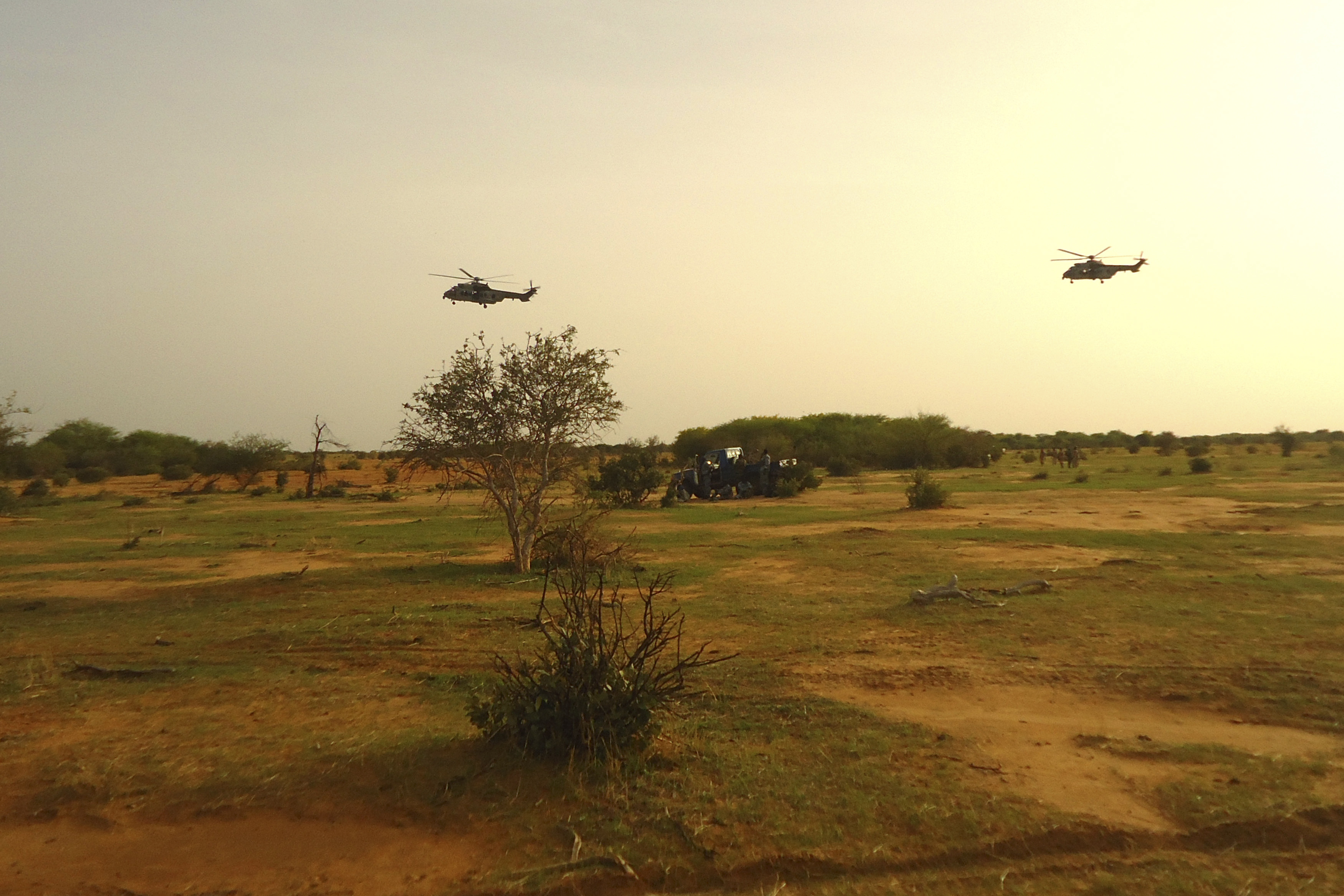 French military helicopters fly above the crash site of Air Alg&eacute;rie Flight 5017 near the northern Mali town of Gossi on July 24, 2014 (Souley Mane Ag Anara—Reuters)