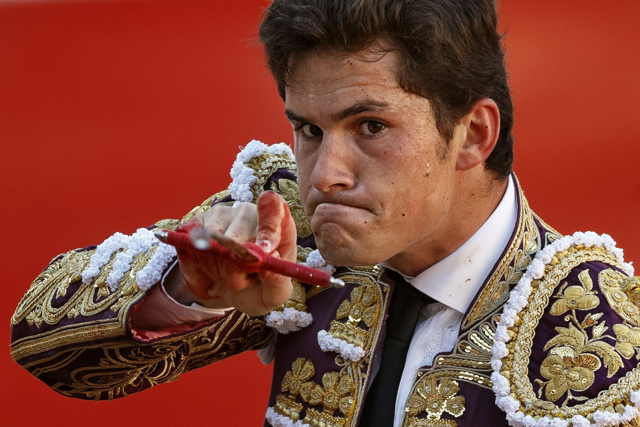 Spanish bullfighter Daniel Luque aims his sword before killing a bull during a bullfight of the San Fermin festival, in Pamplona, Spain on July 7, 2014.