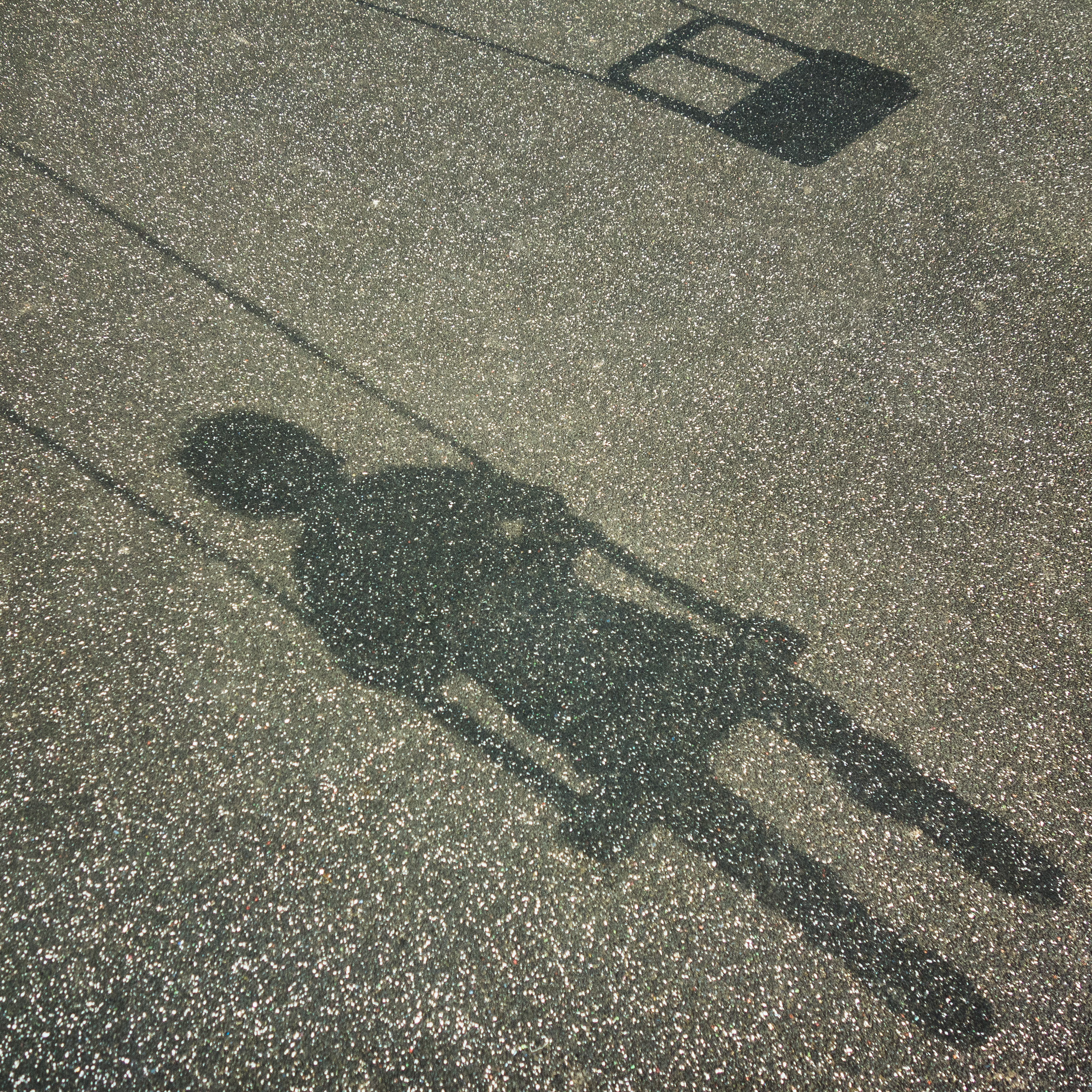 Shadow of child sitting in swing