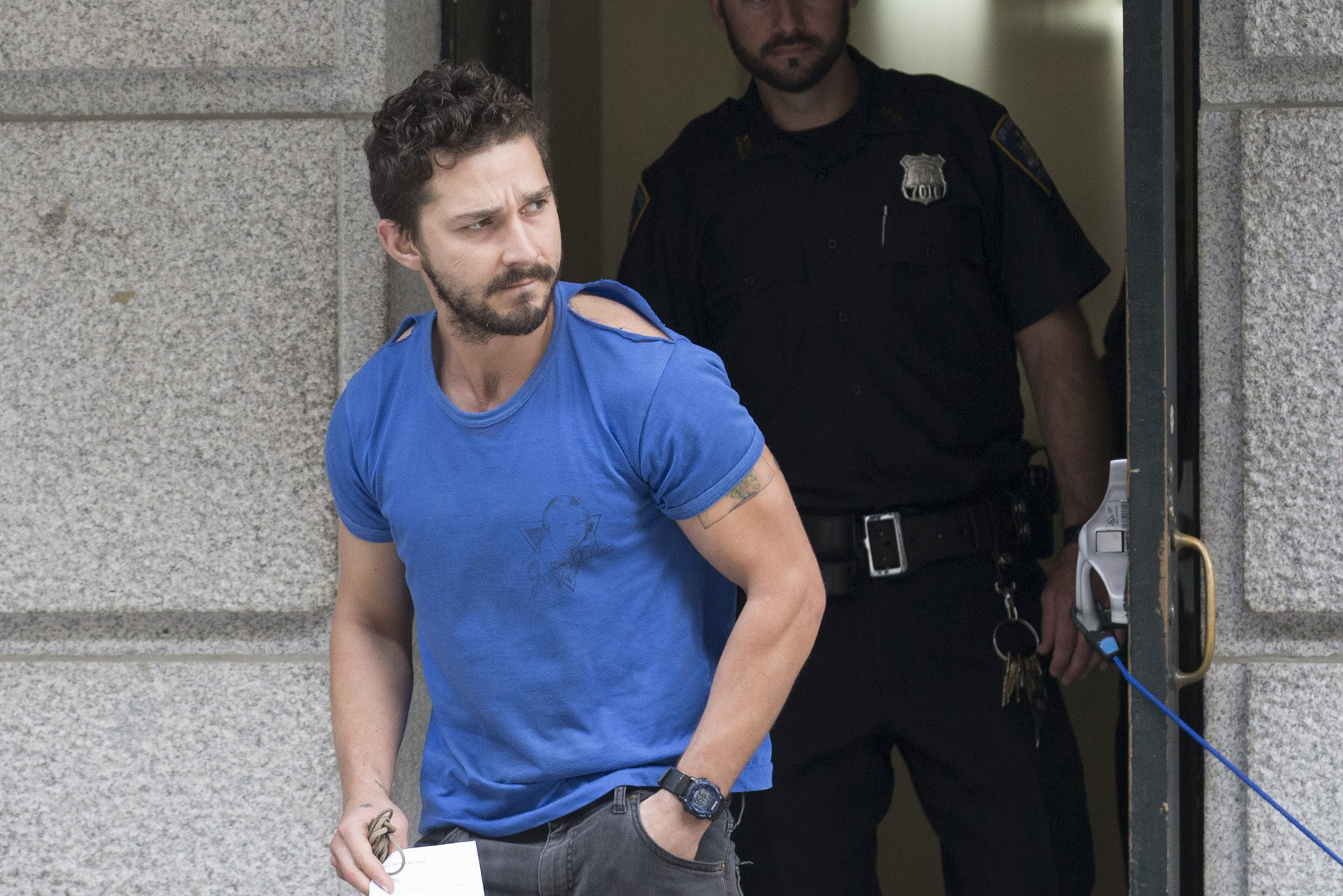 Actor Shia LaBeouf leaves Midtown Community Court after being arrested the previous day for yelling obscenities at the Broadway show "Cabaret," June 27, 2014, in New York. (John Minchillo—AP)