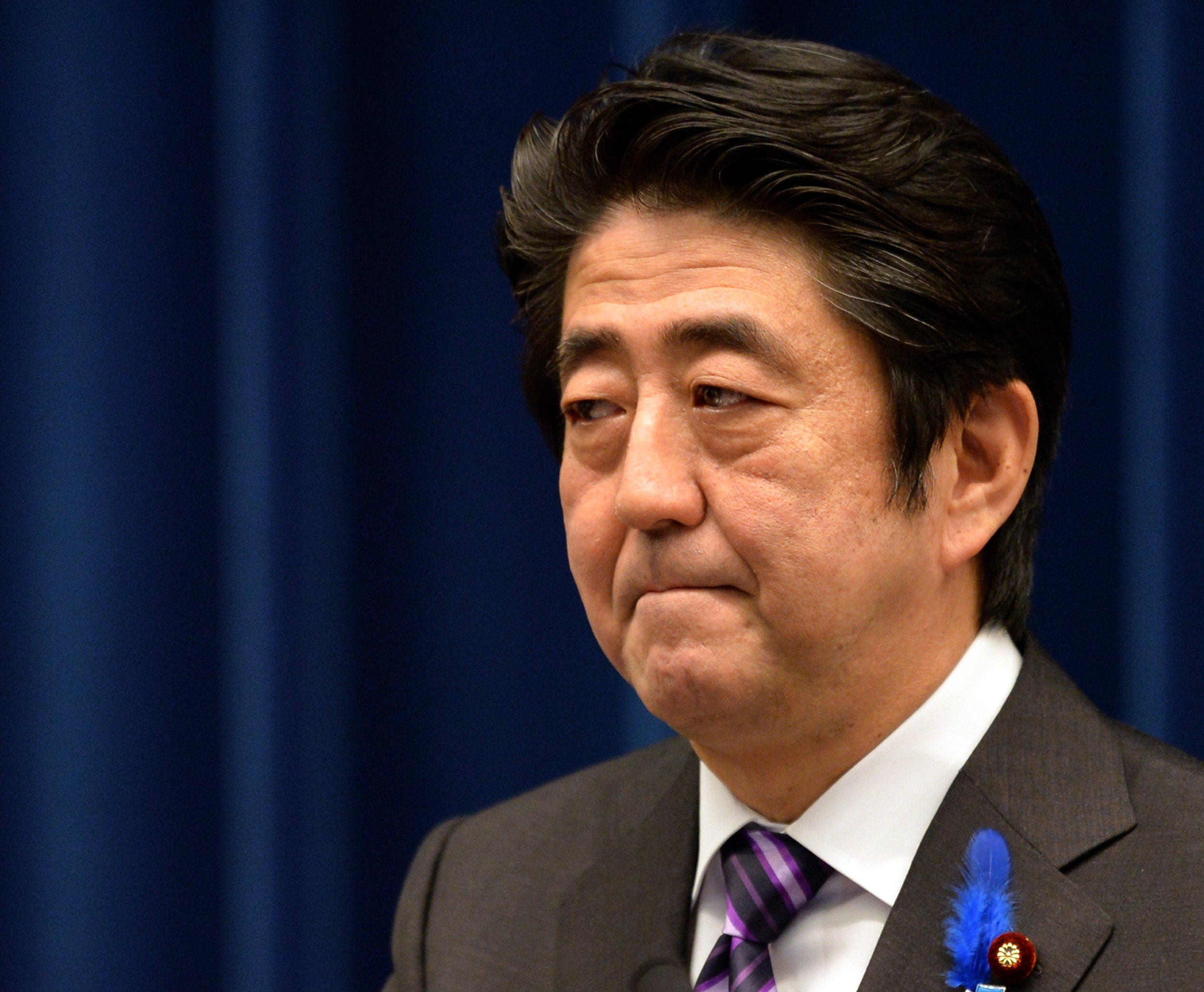 Japanese Prime Minister Shinzo Abe speaks during a press conference at his official residence in Tokyo on July 1, 2014. (Kazuhiro Nogi—AFP/Getty Images)