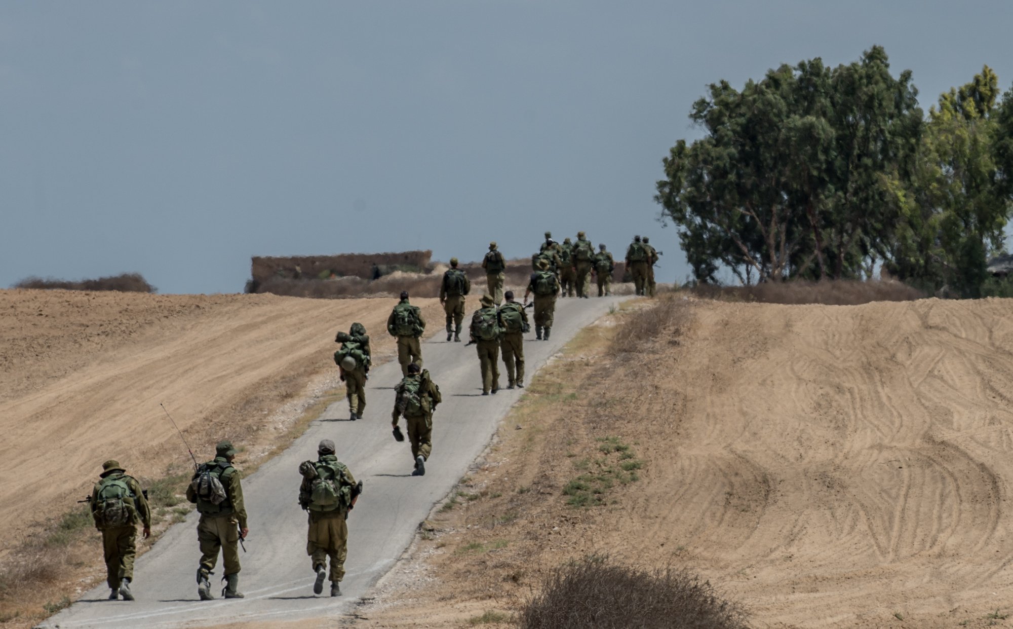 Israeli soldiers march in southern Israel near the border with Gaza, on July 18, 2014, the 11th day of Operation Protective Edge. (Xinhua—Sipa)