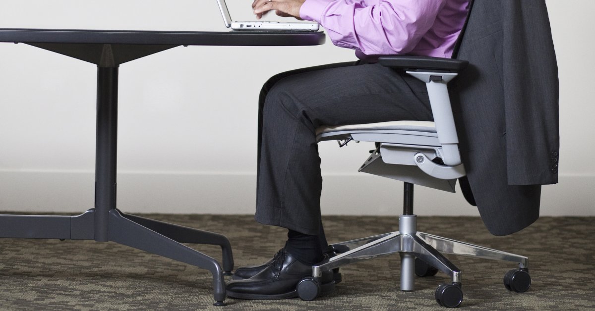 Chair legs. Sitting down. Office Chair. Old broken Office Chair.