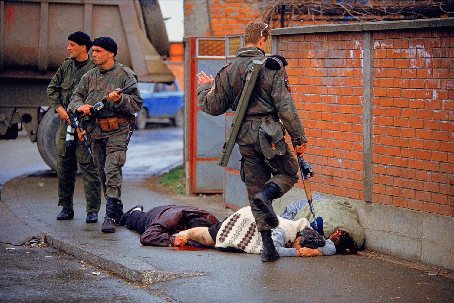 Arkan's Tigers kill and kick Bosnian Muslim civilians during the first battle for Bosnia in Bijeljina, Bosnia on March 31, 1992. T