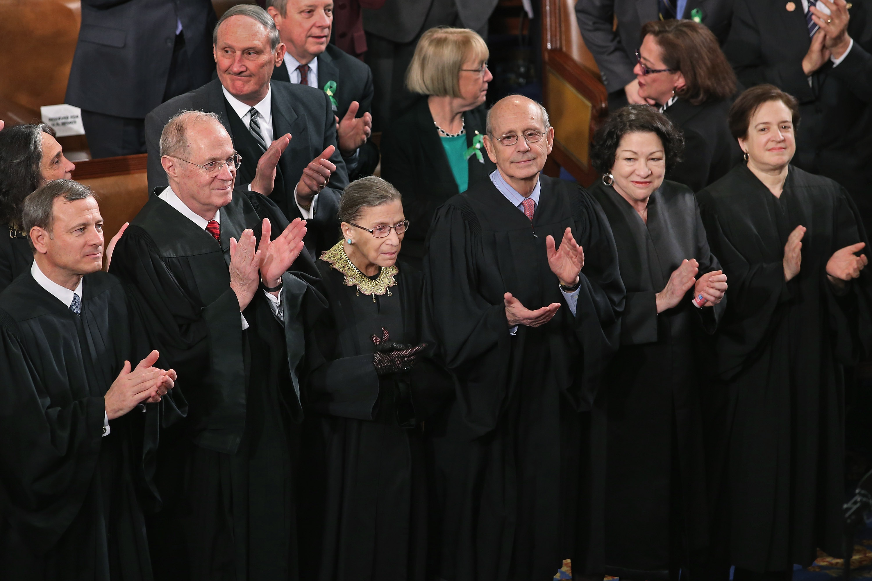 Members of the Supreme Court, (L-R) Chief Justice John Roberts and associate justices Anthony Kennendy, Ruth Bader Ginsburg, John Paul Stevens, Sonia Sotomayor and Elena Kagan, applaud as U.S. President Barack Obama arrives to deliver his State of the Union speech before a joint session of Congress at the U.S. Capitol in Washington on February 12, 2013. (Chip Somodevilla—Getty Images)