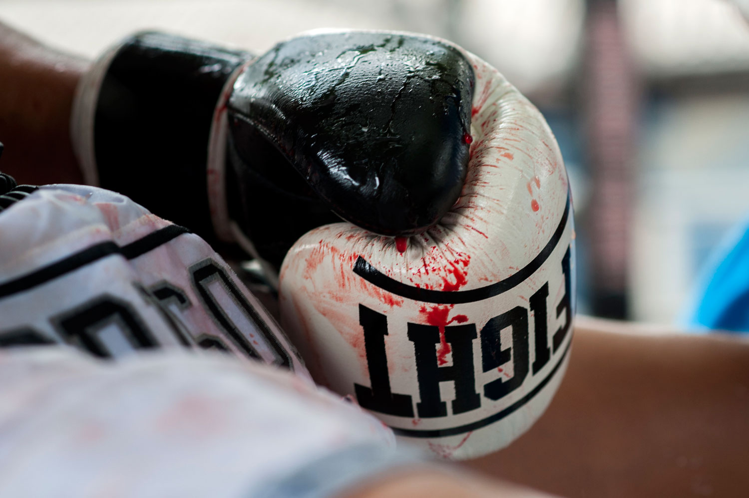Detail of a bloody boxing glove as an inmate rests during a Muay Thai fight at Klong Pai prison on July 12, 2014 in Nakhon Ratchasima, Thailand.