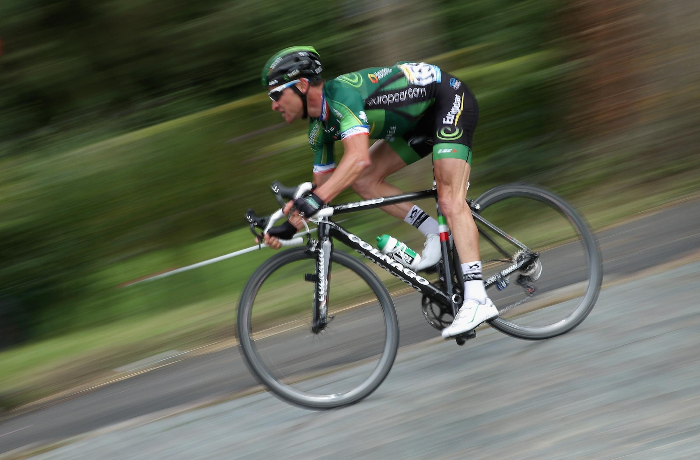 Thomas Voeckler of France and Team Europcar descends on the cobblestone streets during stage four of the 2014 Tour de France from Touquet-Paris-Plage to Lille on July 8, 2014 in Cassel, France.