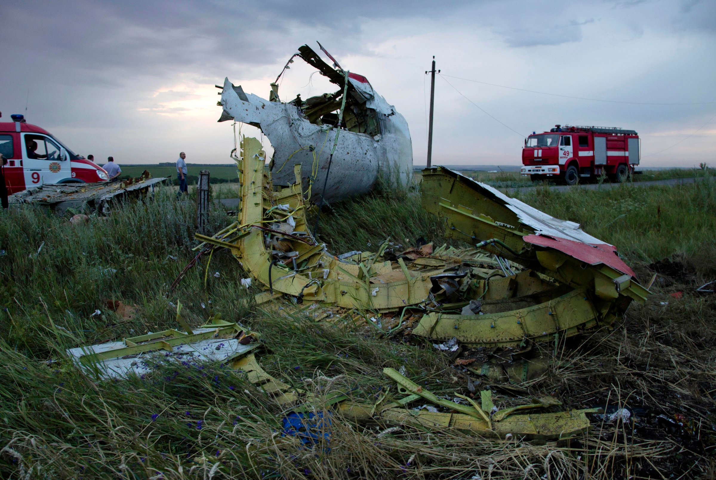 Firefighters arrive at the crash site of Malaysia Airlines Flight 17 near the village of Hrabove, Ukraine, on July 17, 2014.