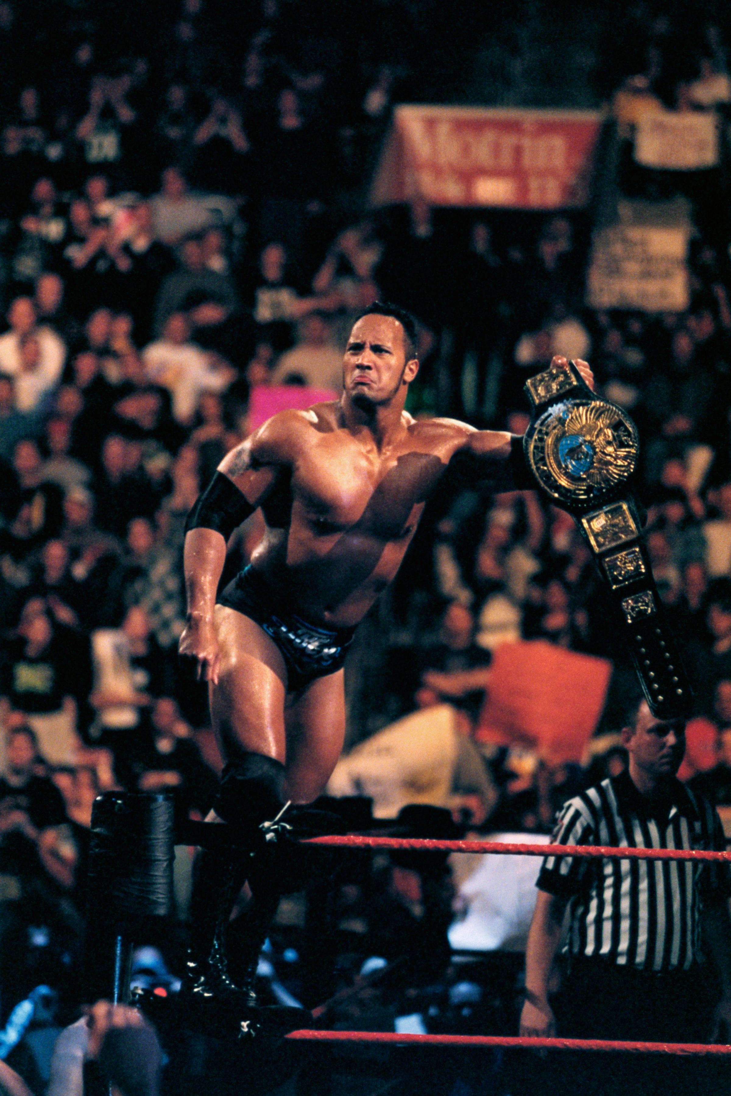 Professional Wrestler The Rock with Championship Belt