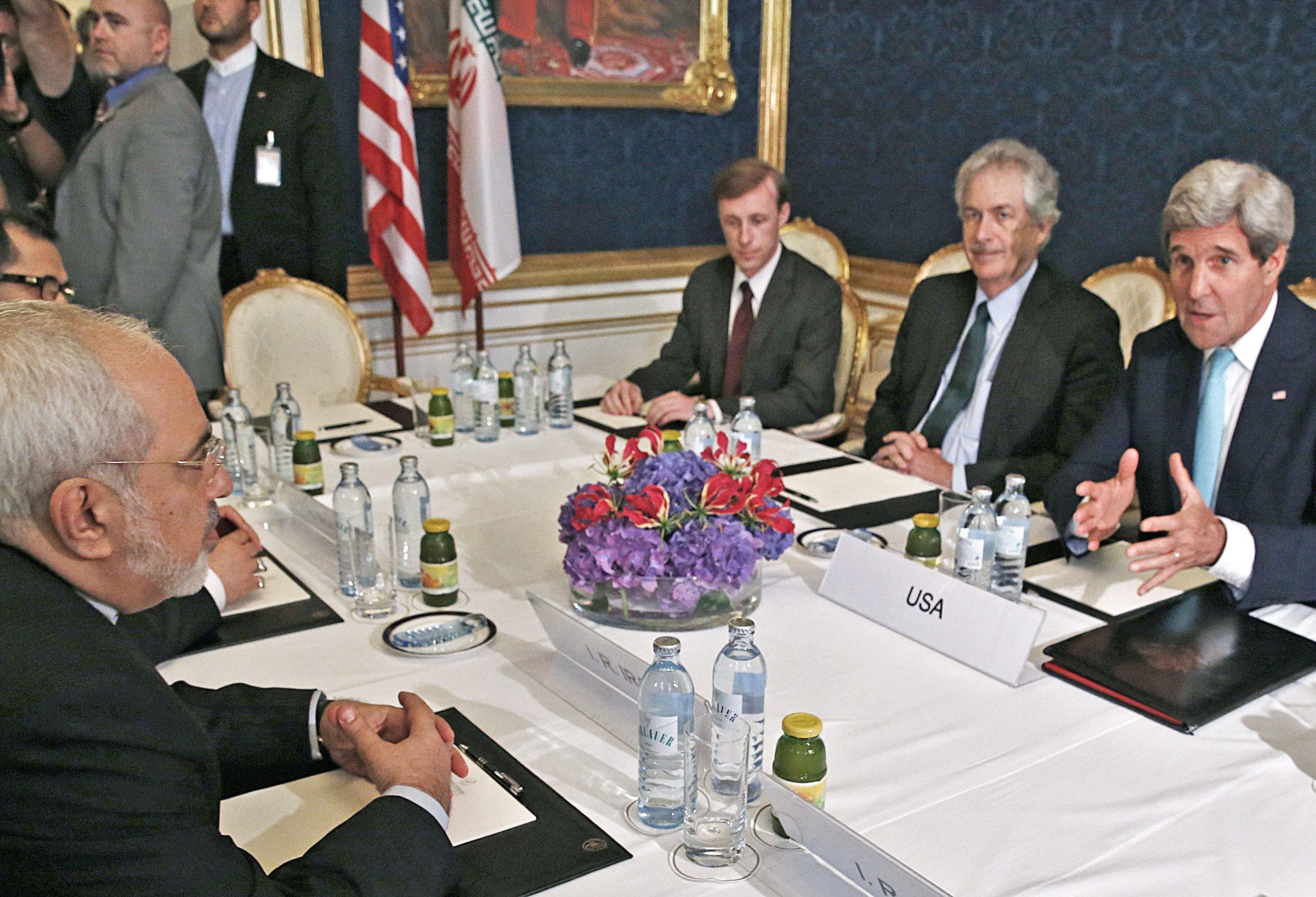 From left: Iran's Foreign Minister Mohammad Javad Zarif meets with U.S. Secretary of State John Kerry during talks between the foreign ministers of the six powers negotiating with Tehran on its nuclear program, in Vienna, on July 13, 2014.