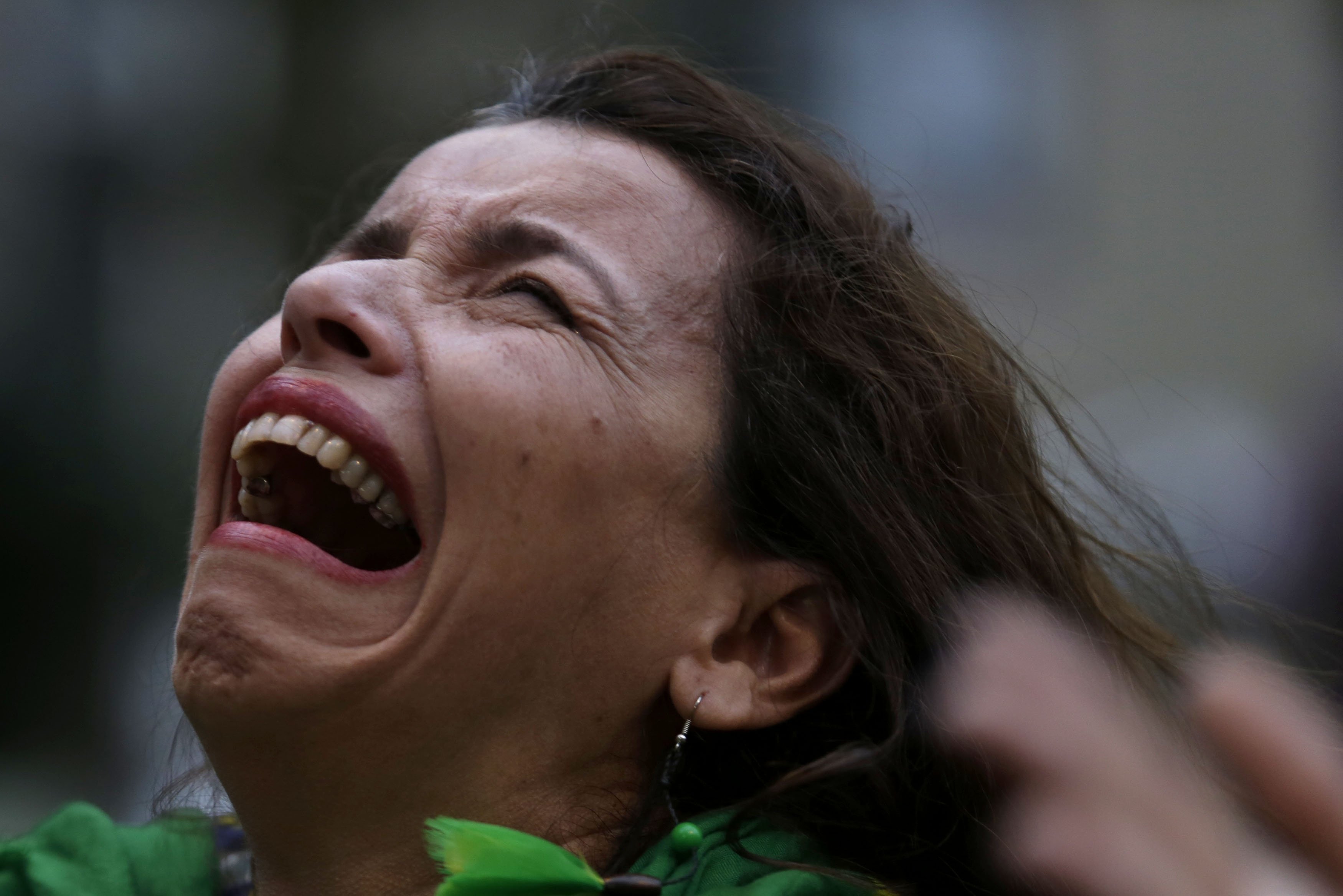 A Brazilian soccer fan cries as she watches a live telecast of the match between Brazil and Germany in Belo Horizonte, Brazil on July 08, 2014.