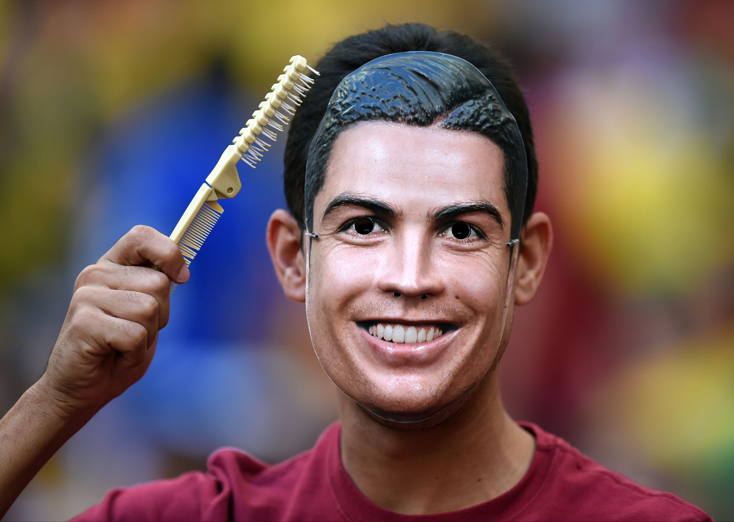 A Portugal supporter wears a Ronaldo mask before the match between Portugal and Ghana at the Estadio Nacional in Brasilia, Brazil on June 26, 2014.