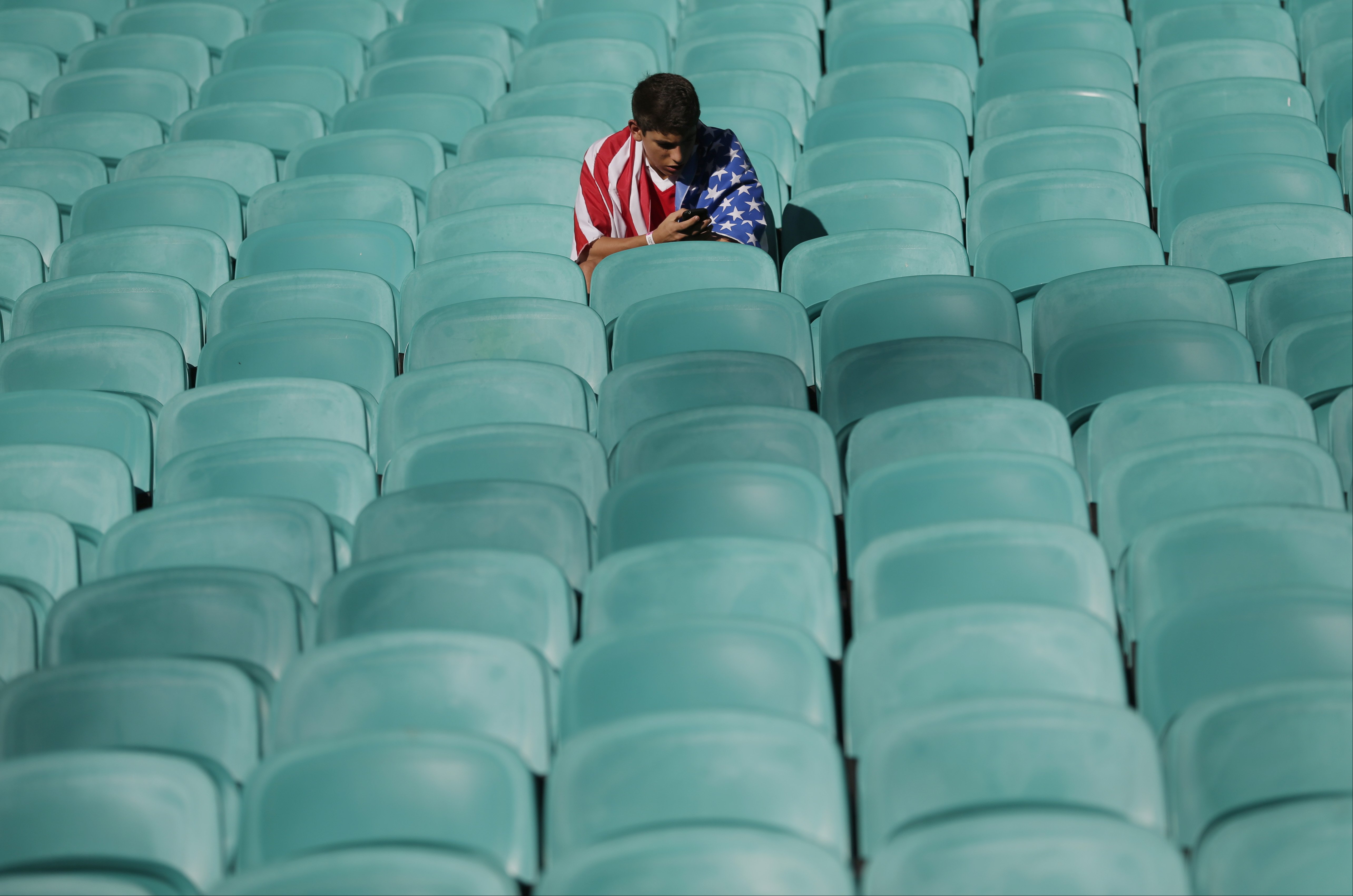 A US fan waits for the beginning of the match between Belgium and the USA at the Arena Fonte Nova in Salvador, Brazil on July 1, 2014.