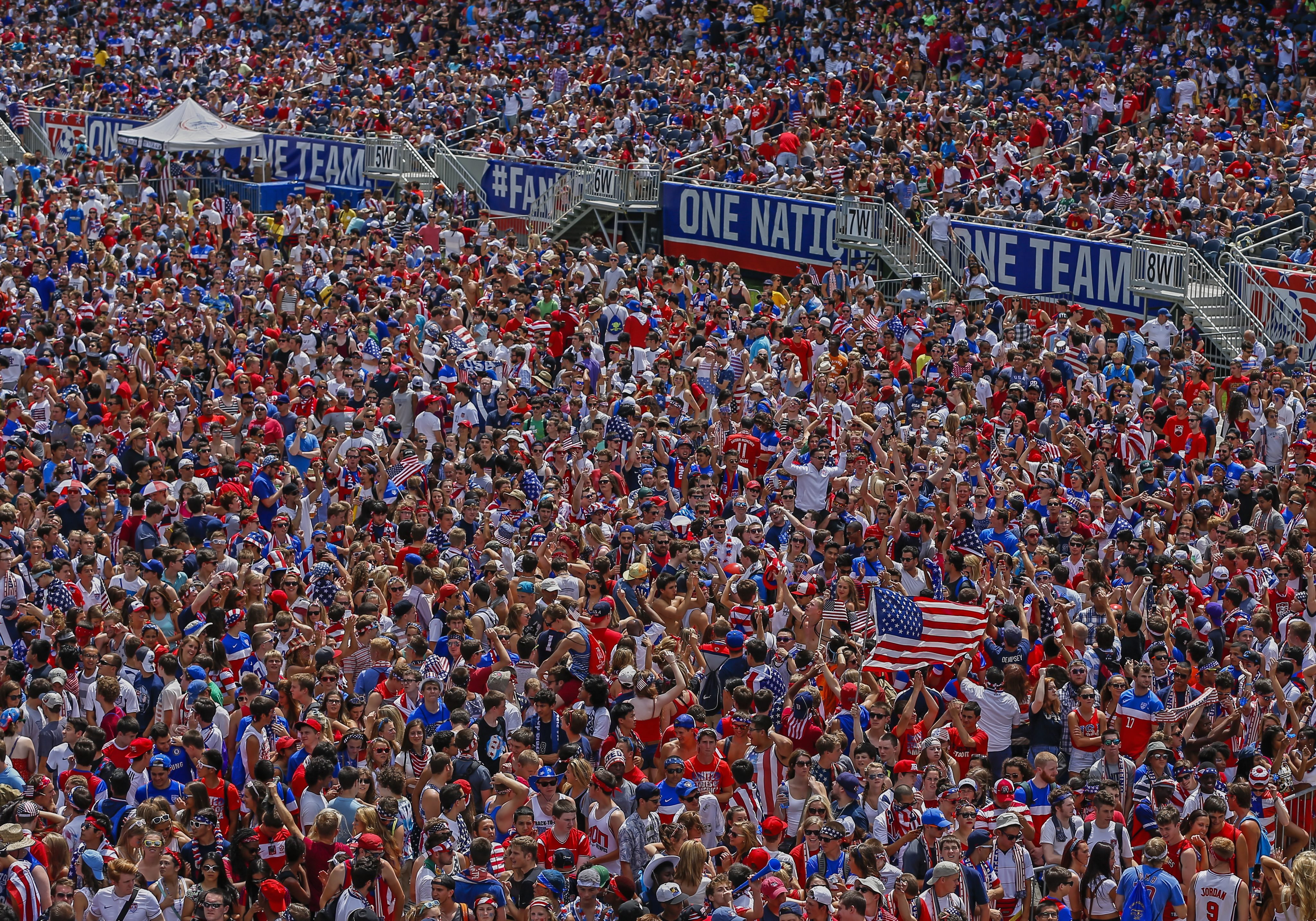 US fans cheer during a screening of the match between the USA and Belgium played at the Arena Fonte Nova in Salvador, Brazil, at Soldier Field in Chicago, Illinois on July 1, 2014.