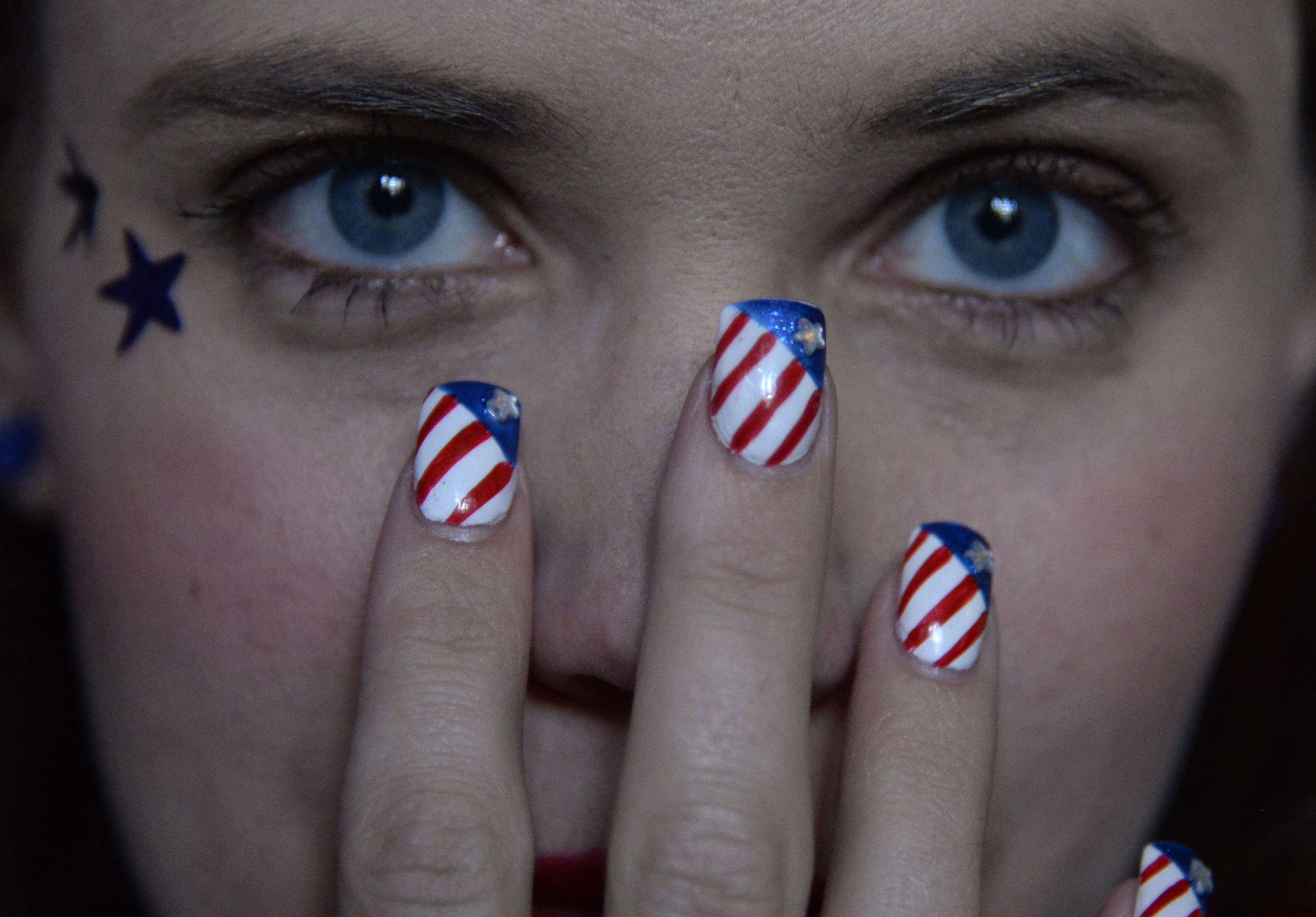 Tarayn Svalverg had her nails painted special for this game as fans gather at The Three Lions, USA on July 1, 2014.