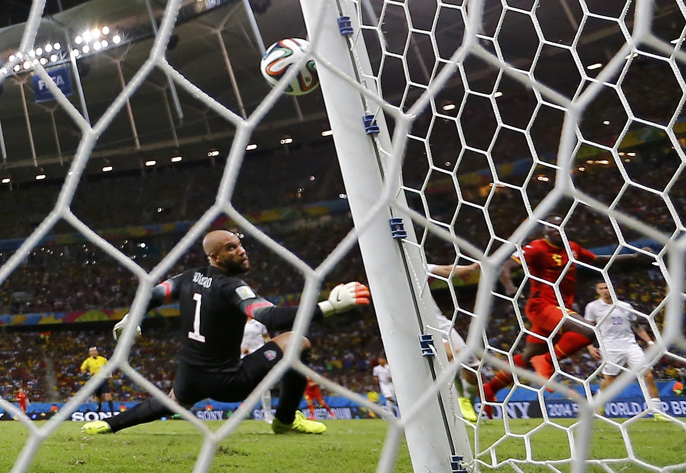 Belgium's Romelu Lukaku scores his team's second goal of the match past Tim Howard of the U.S. at the Fonte Nova arena in Salvador, Brazil, on July 1, 2014