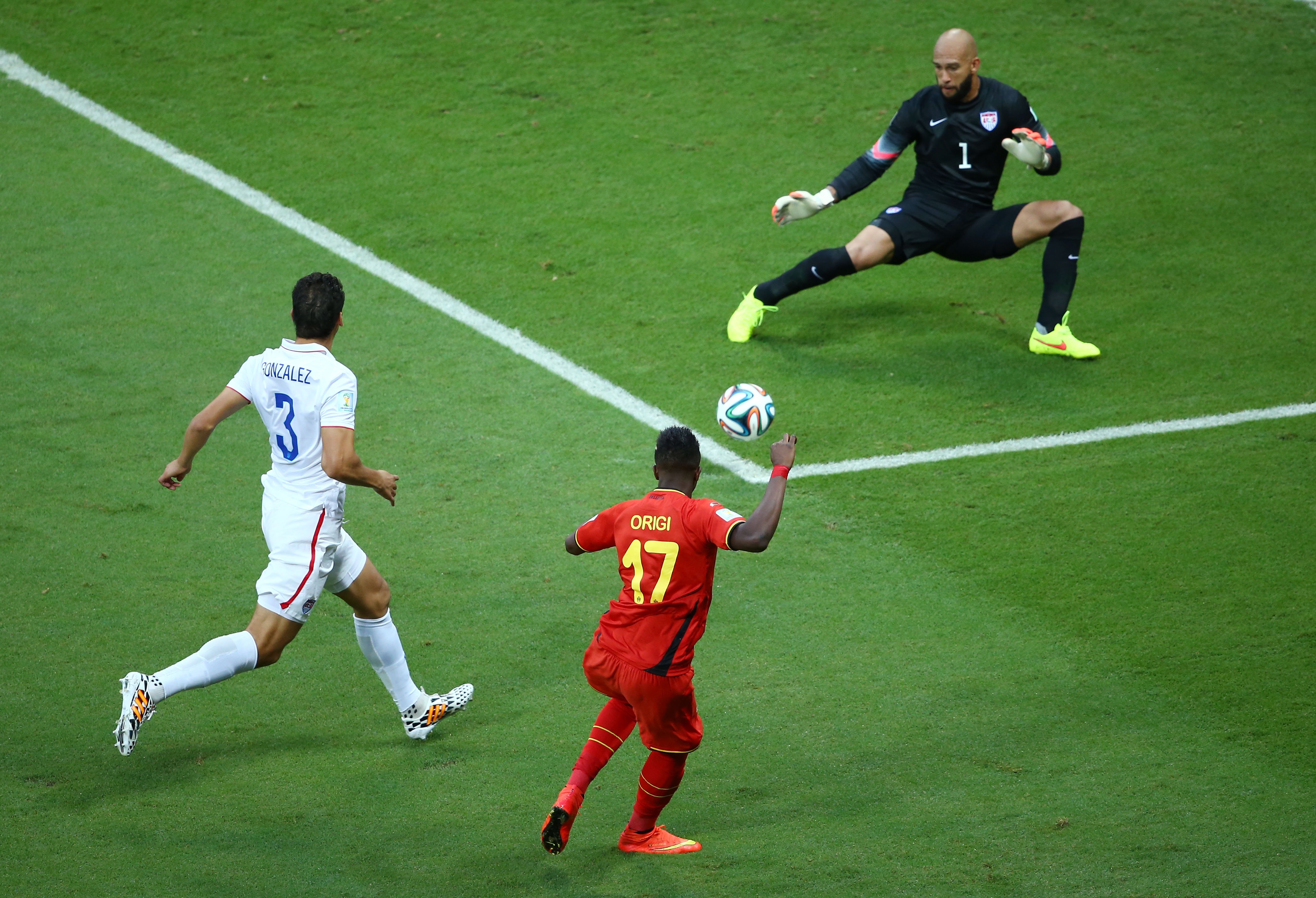 Divock Origi of Belgium shoots against Tim Howard of the United States during the match between Belgium and the United States at Arena Fonte Nova on July 1, 2014 in Salvador, Brazil.