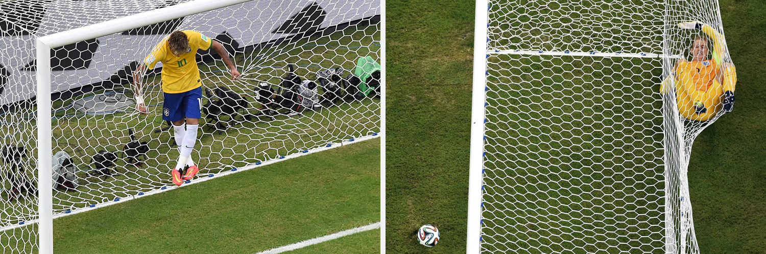 England's goalkeeper Hart rolls inside the goalpost after Italy's Balotelli scored during their 2014 World Cup Group D soccer match at the Amazonia arena in Manaus