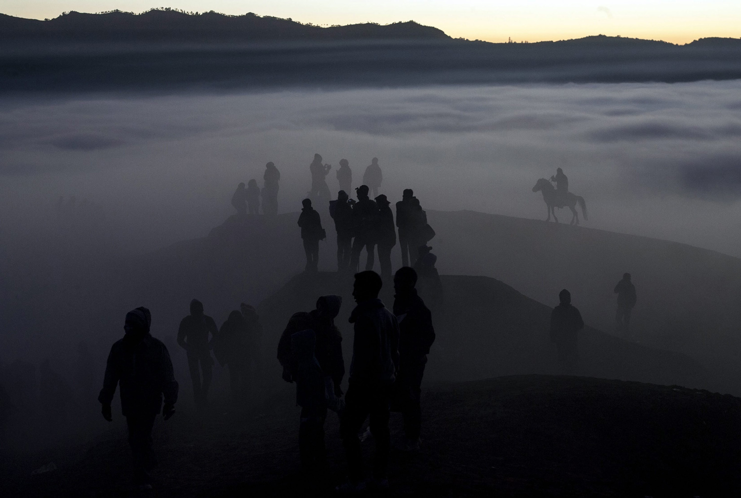 Aug. 12,  2014. Indonesian villagers walk to the crater during the Kasodo ceremony at Mount Bromo, Probolinggo, Indonesia.