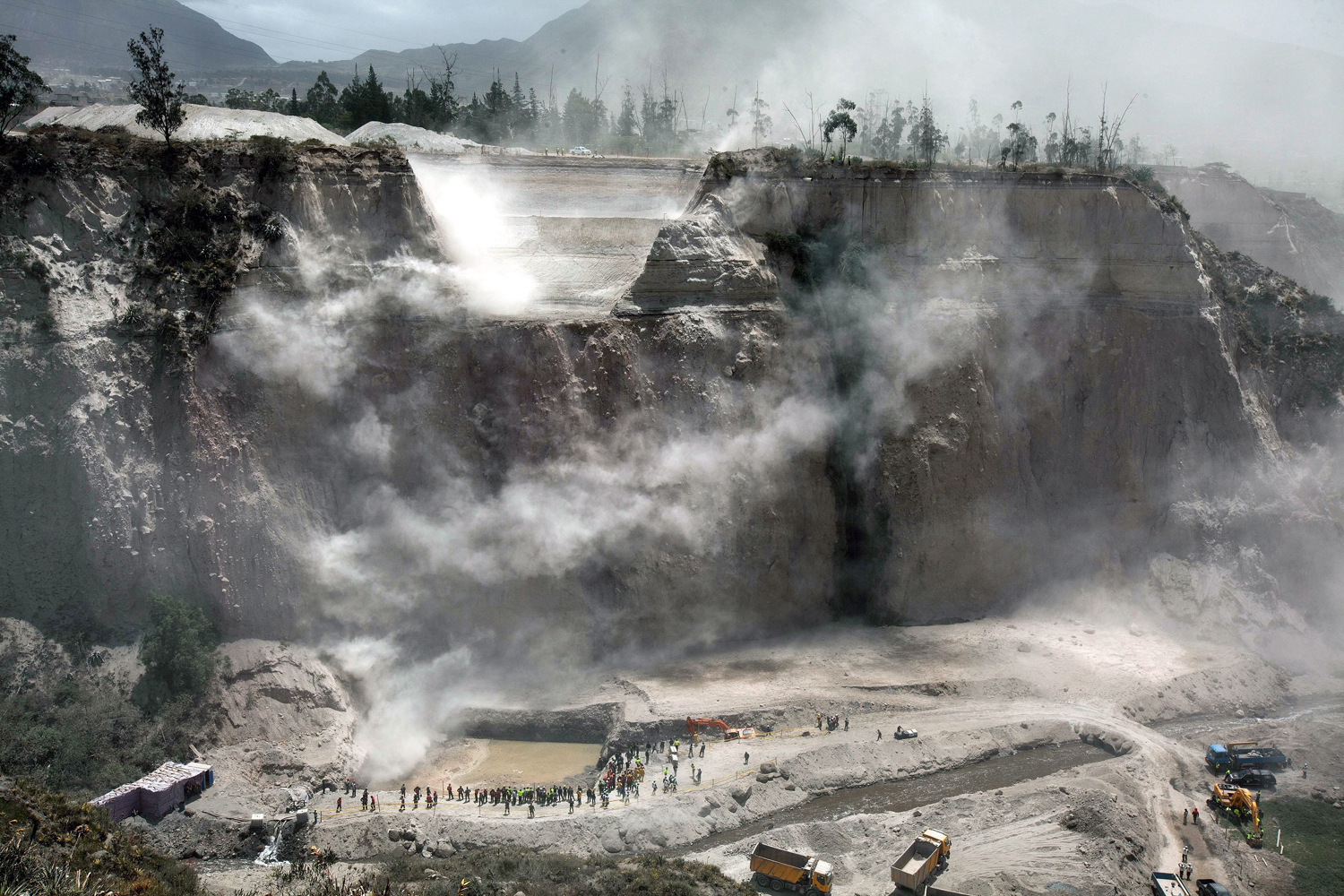 Aug. 13, 2014.  A general view of rescue workers during search and rescue operations at a quarry in the area of Catequilla, Ecuador, where a landslide occured on 12 August due to a 5.1 magnitude earthquake registered in the north of the city of Quito.