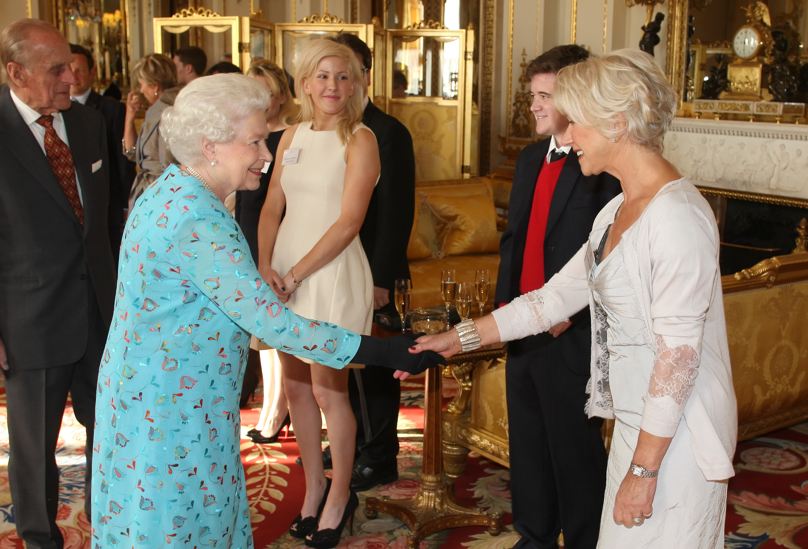 Queen Elizabeth II meets with Dame Helen Mirren (R) at a performing Arts reception at Buckingham Palace on May 9, 2011 in London, England. (Dominic Lipinski — WPA Pool/Getty Images)